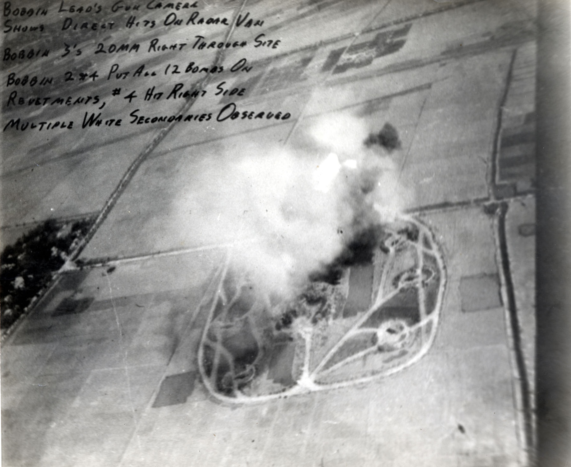 SAM site being destroyed. After initial attack by a Wild Weasel, it was struck with bombs that set off secondary explosions. (U.S. Air Force photo)