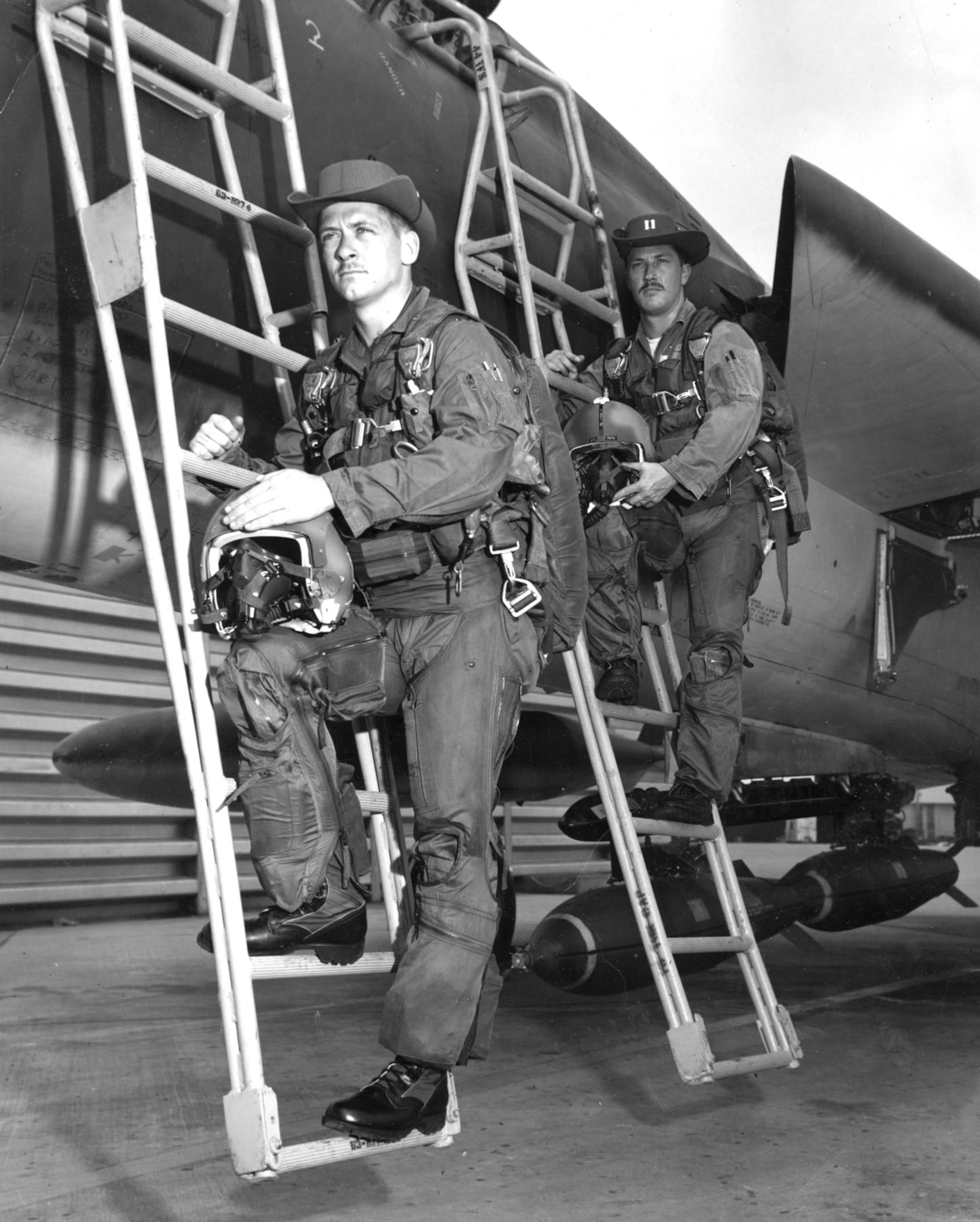 Individual crews had their pictures taken when they arrived in theater, like this one taken at Korat in 1968. Capt. George Connolly (l) and Capt. Larry LeMieux (r) are both wearing the commonly worn, locally-made “boonie hat.” (U.S. Air Force photo)