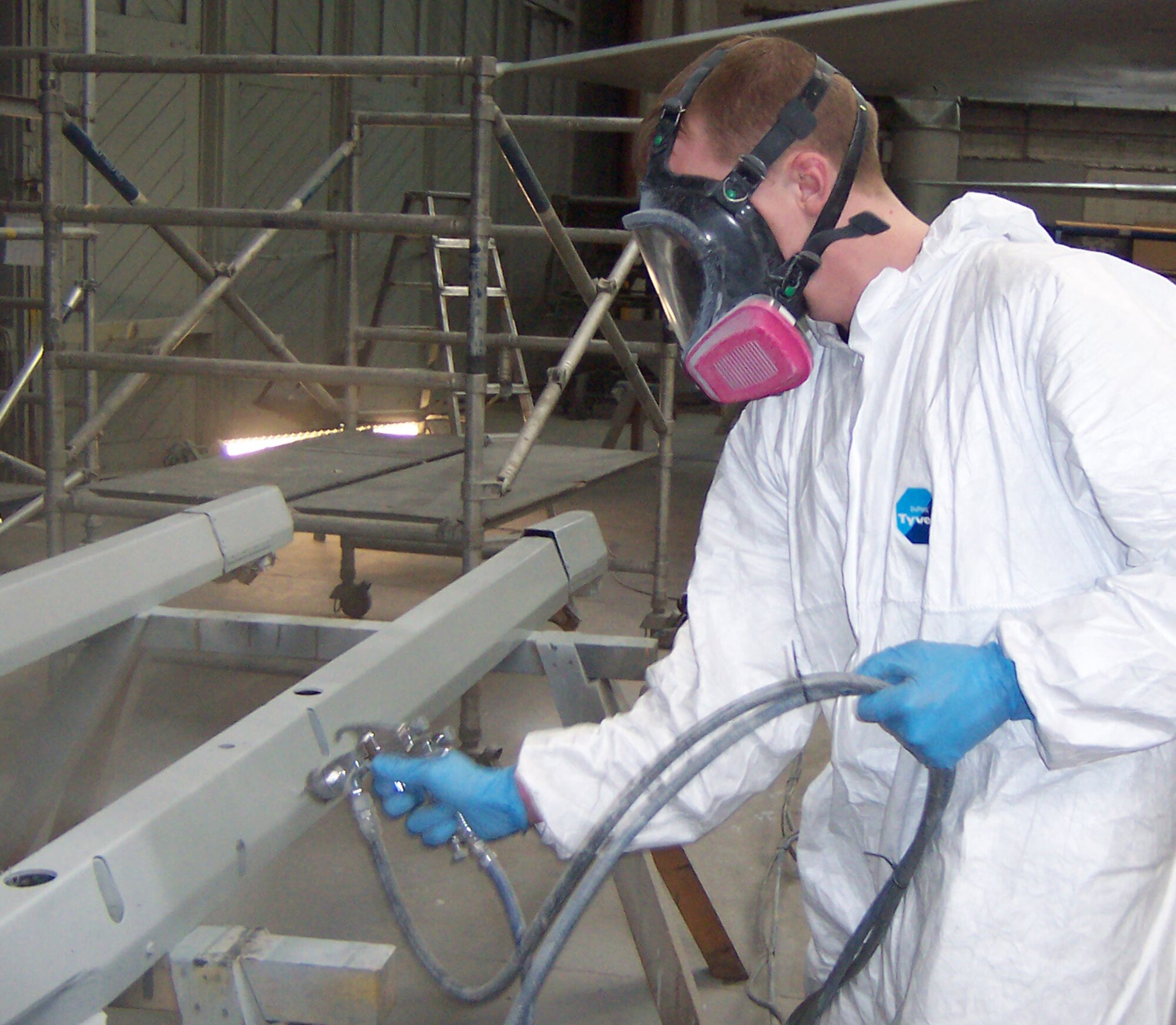 Staff Sgt. Kevin Stevens, 48th Equipment Maintenance Squadron, repaints a piece of an F-15A aircraft for display in the Imperial War Museum Duxford April 4, 2009. Eighteen Airmen from RAF Lakenheath’s 48th EMS corrosion control flight, volunteered approximately 70 hours each of off-duty time over a period of eight weeks to restore the aircraft to its original 5th Fighter Intercept Squadron markings. (U.S. Air Force photo by Airman 1st Class Steven Stockfish)