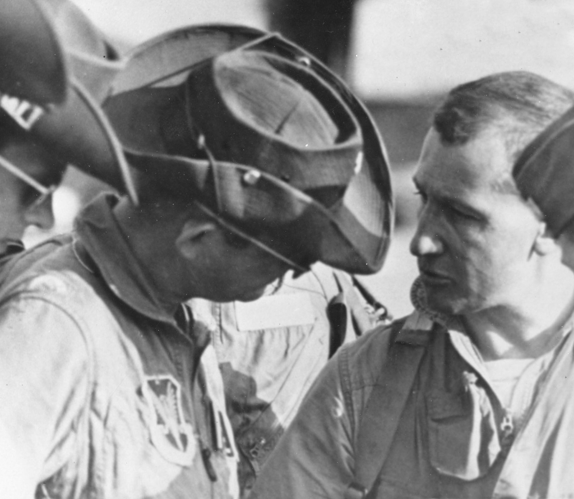Maj. Willard (l) talking to Capt. Lamb on the flightline at Korat on March 4, 1966.  Lamb had just landed from a mission in which he and Capt. Frank O’Donnell had destroyed a SAM site (the third for Lamb). (U.S. Air Force photo)