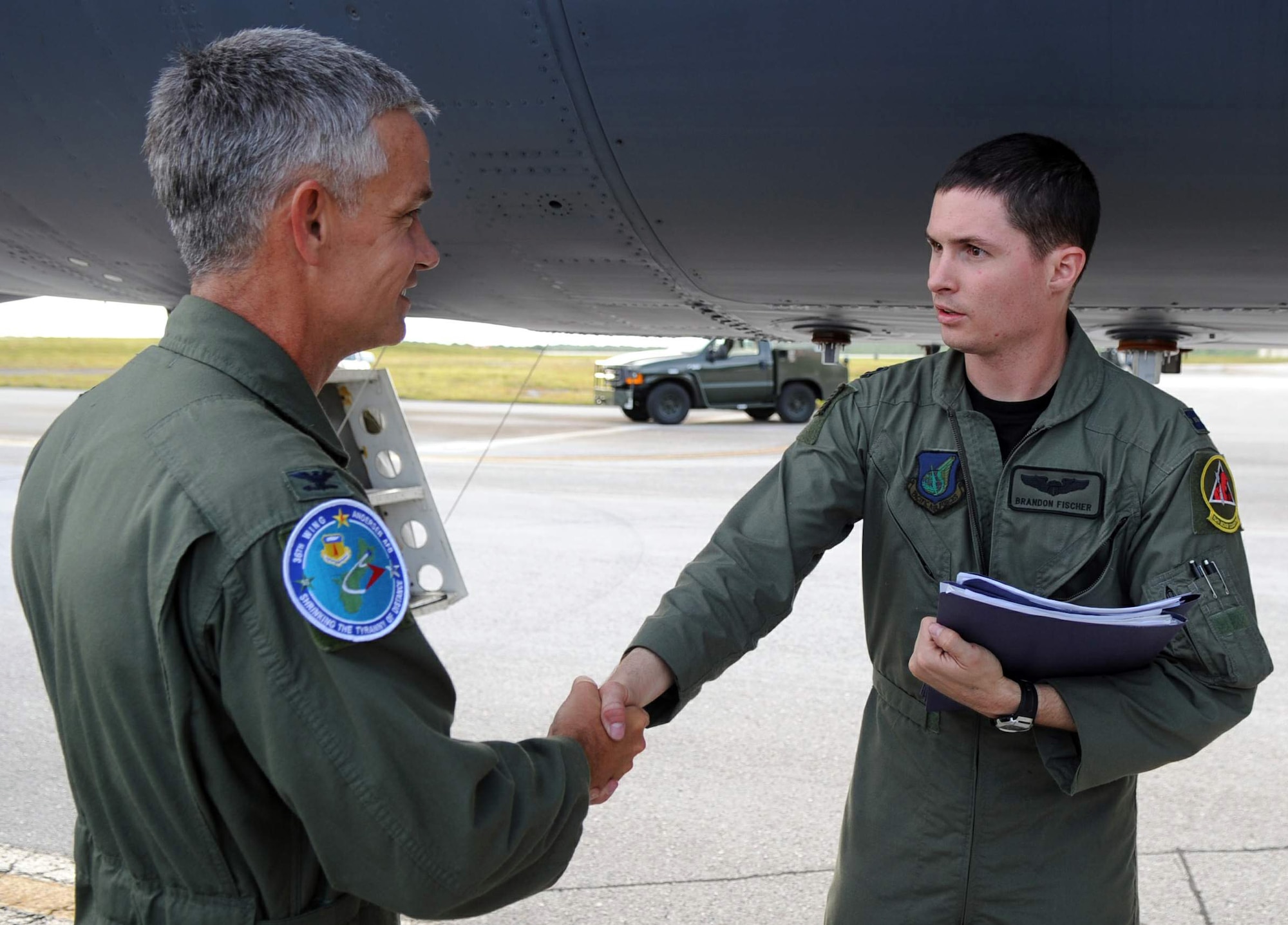 Col. Tod Fingal greets Capt. Brandon Fischer after a 17-hour flight May 30 from Barksdale Air Force Base, La., to Andersen Air Force Base, Guam. Three B-52 Stratofortress bombers arrived here May 30. Colonel Fingal is the 36th Operations Group commander and Captain Fischer is a 96th Expeditionary Bomb Squadron aircraft commander. (U.S. Air Force photo/Senior Airman Christopher Bush) 
