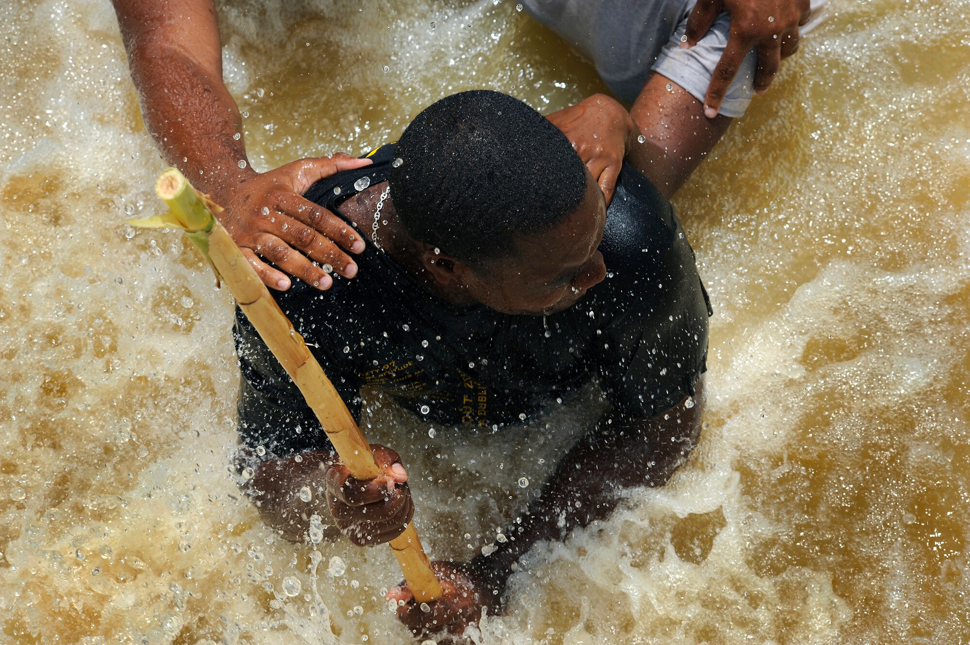 Constable Damon Kangal of the Royal St. Lucia Police Force's Special Service Unit leads a team in a "wedge" formation while practicing swift-water rescue procedures that were taught by U.S. Air Force pararescuemen June 5 during Operation Southern Partner at La Toc, St. Lucia. Operation Southern Partner is a long term commitment between U.S. and partner nations to share experiences, information, vital skills, tactics and techniques in preparation for future regional challenges that require cooperative solutions.  (U.S. Air Force photo/Staff Sgt. Bennie J. Davis III)