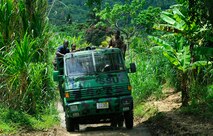 Members of the Royal St. Lucia Police Force's Special Service Unit make their way through the jungle terrain June 5 in search of a location to practice swift-water rescue procedures that were being taught by U.S. Air Force pararescuemen during Operation Southern Partner at La Toc, St. Lucia. Operation Southern Partner is a long term commitment between U.S. and partner nations to share experiences, information, vital skills, tactics and techniques in preparation for future regional challenges that require cooperative solutions.  (U.S. Air Force photo/Staff Sgt. Bennie J. Davis III)