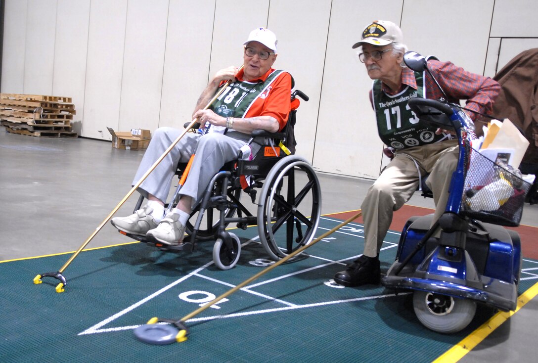 Robert Blatnik, right, an 89-year-old retired Army and World War II veteran, competes in shuffleboard against Jack Faust, a 98-year-old Navy and World War II veteran, June 3, 2009, in Birmingham, Ala., at the 23rd Annual National Veterans Golden Age Games. DoD photo by Army Sgt. 1st Class Michael J. Carden