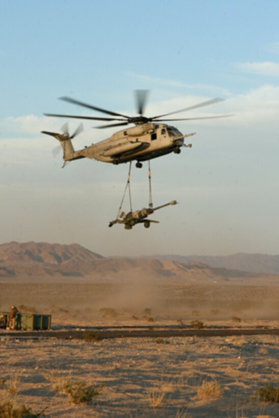 A CH-53 E helicopter with Marine Heavy Helicopter Squadron 462 lifts a M-777 Howitzer at Marine Corps Air Ground Combat Center Twentynine Palms, Calif. June 5. Lifting the Howitzer was something new for the pilots who normally lift concrete training blocks.