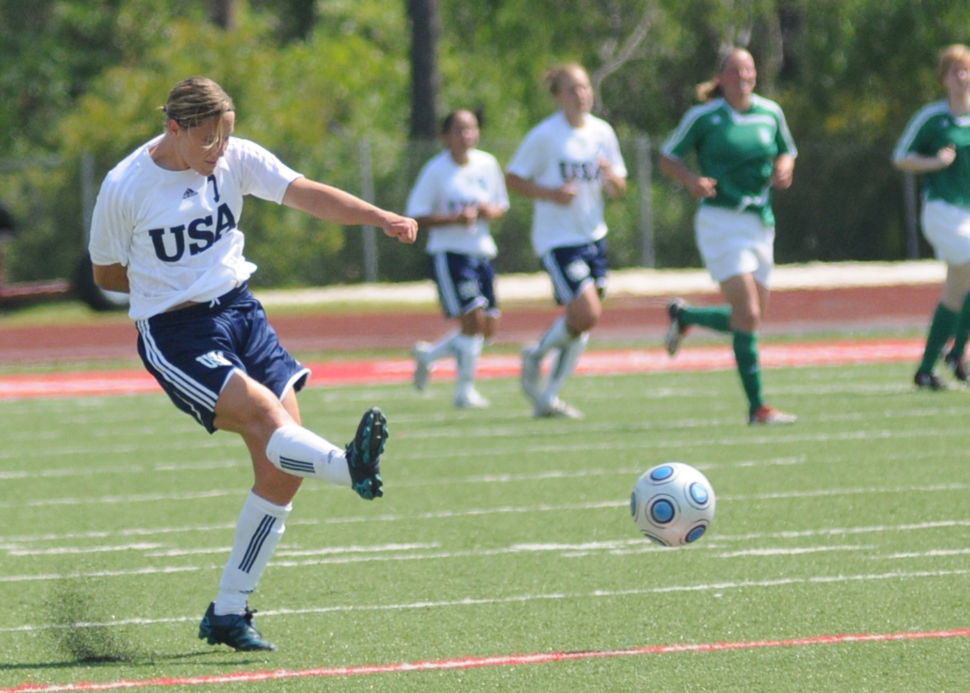 The United States and Germany compete during the 5th CISM Women’s Soccer Championship at Biloxi High School Stadium 6 June.  The CISM tournament, hosted by Keesler Air Force Base, includes teams from Brazil, Canada, France, Germany, The Netherlands, The Republic of South Korea and the United States.  Matches are being held June 6 to 13, with the Gold match June 13 at 2 p.m.  Organizers say the tournament gives teams and people who attend a chance to develop bonds and life-long friendships between the countries and a chance to learn about one another’s cultural similarities and differences.  (U.S. Air Force photo by Kemberly Groue)
