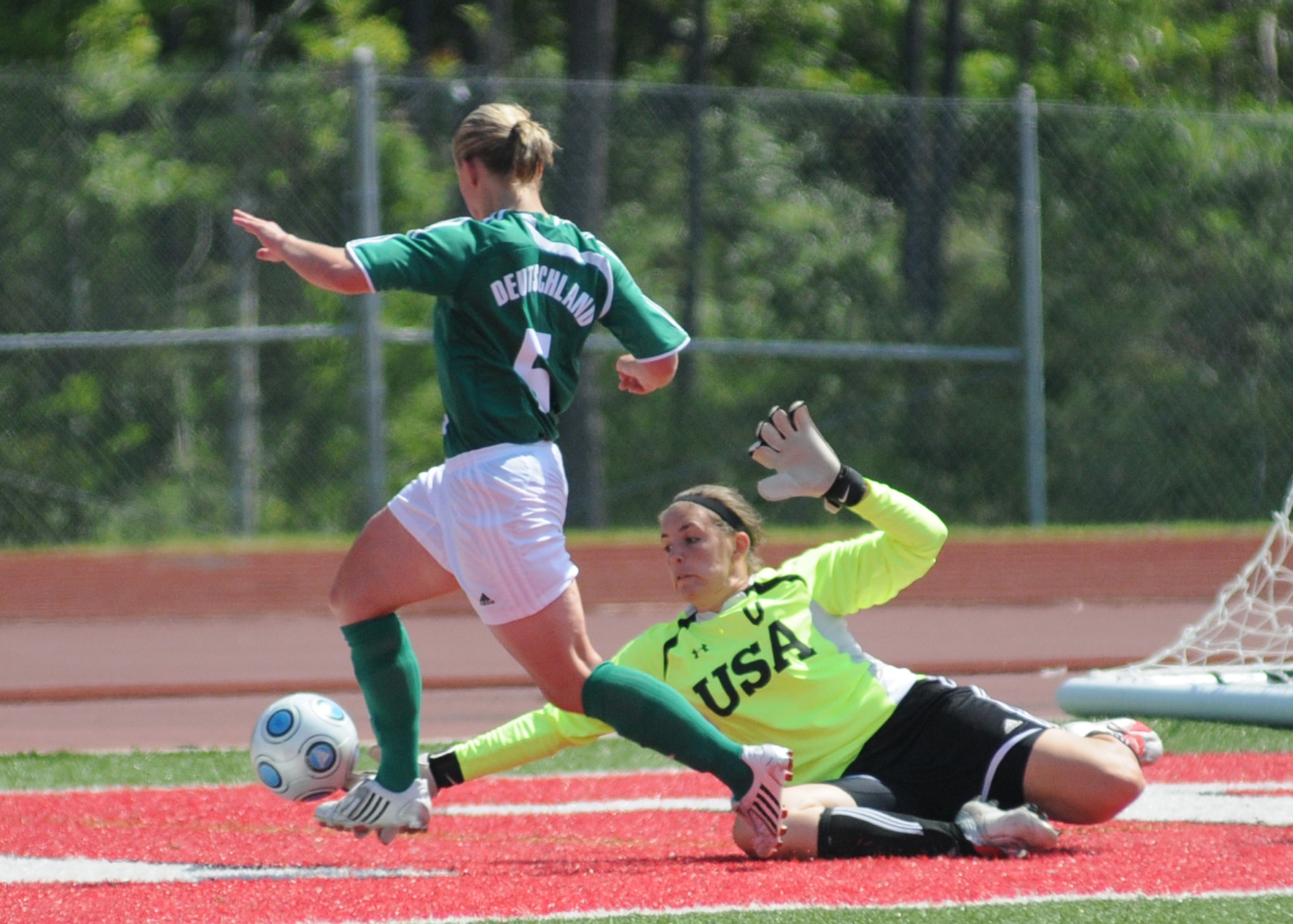 The United States and Germany compete during the 5th CISM Women’s Soccer Championship at Biloxi High School Stadium 6 June.  The CISM tournament, hosted by Keesler Air Force Base, includes teams from Brazil, Canada, France, Germany, The Netherlands, The Republic of South Korea and the United States.  Matches are being held June 6 to 13, with the Gold match June 13 at 2 p.m.  Organizers say the tournament gives teams and people who attend a chance to develop bonds and life-long friendships between the countries and a chance to learn about one another’s cultural similarities and differences.  (U.S. Air Force photo by Kemberly Groue)