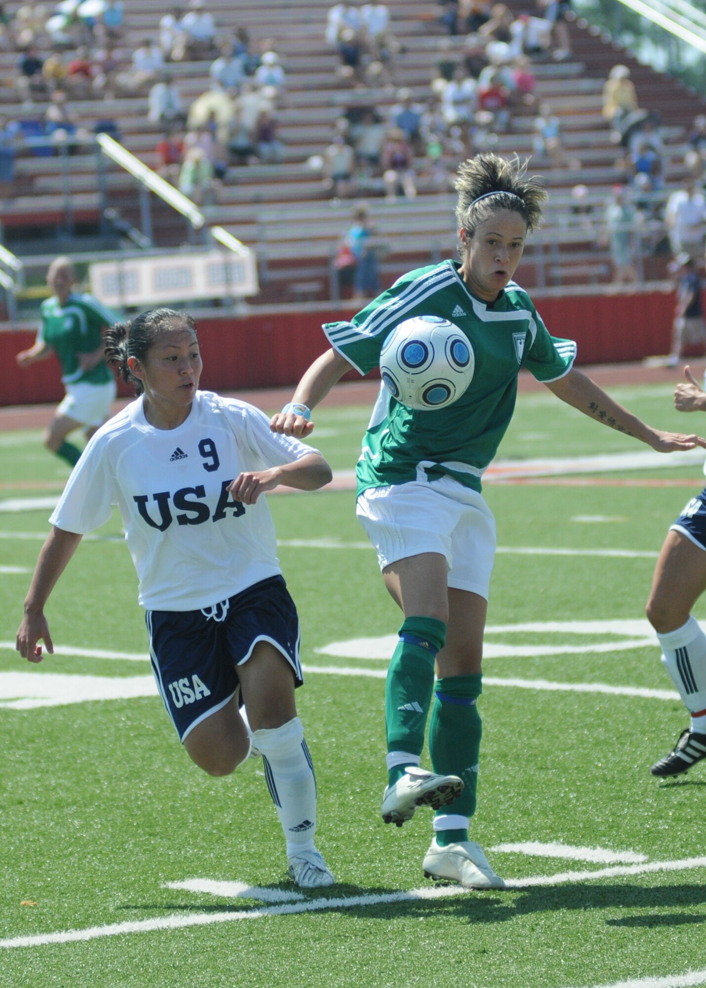 The United States and Germany compete during the 5th CISM Women’s Soccer Championship at Biloxi High School Stadium 6 June.  The CISM tournament, hosted by Keesler Air Force Base, includes teams from Brazil, Canada, France, Germany, The Netherlands, The Republic of South Korea and the United States.  Matches are being held June 6 to 13, with the Gold match June 13 at 2 p.m.  Organizers say the tournament gives teams and people who attend a chance to develop bonds and life-long friendships between the countries and a chance to learn about one another’s cultural similarities and differences.  (U.S. Air Force photo by Kemberly Groue)
