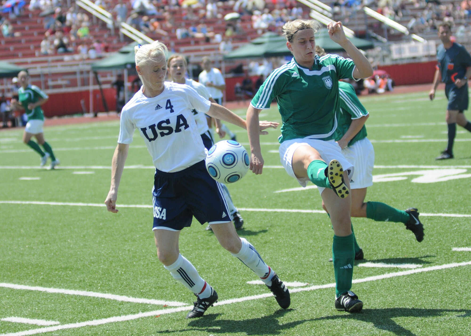 The United States and Germany compete during the 5th CISM Women’s Soccer Championship at Biloxi High School Stadium 6 June.  The CISM tournament, hosted by Keesler Air Force Base, includes teams from Brazil, Canada, France, Germany, The Netherlands, The Republic of South Korea and the United States.  Matches are being held June 6 to 13, with the Gold match June 13 at 2 p.m.  Organizers say the tournament gives teams and people who attend a chance to develop bonds and life-long friendships between the countries and a chance to learn about one another’s cultural similarities and differences.  (U.S. Air Force photo by Kemberly Groue)