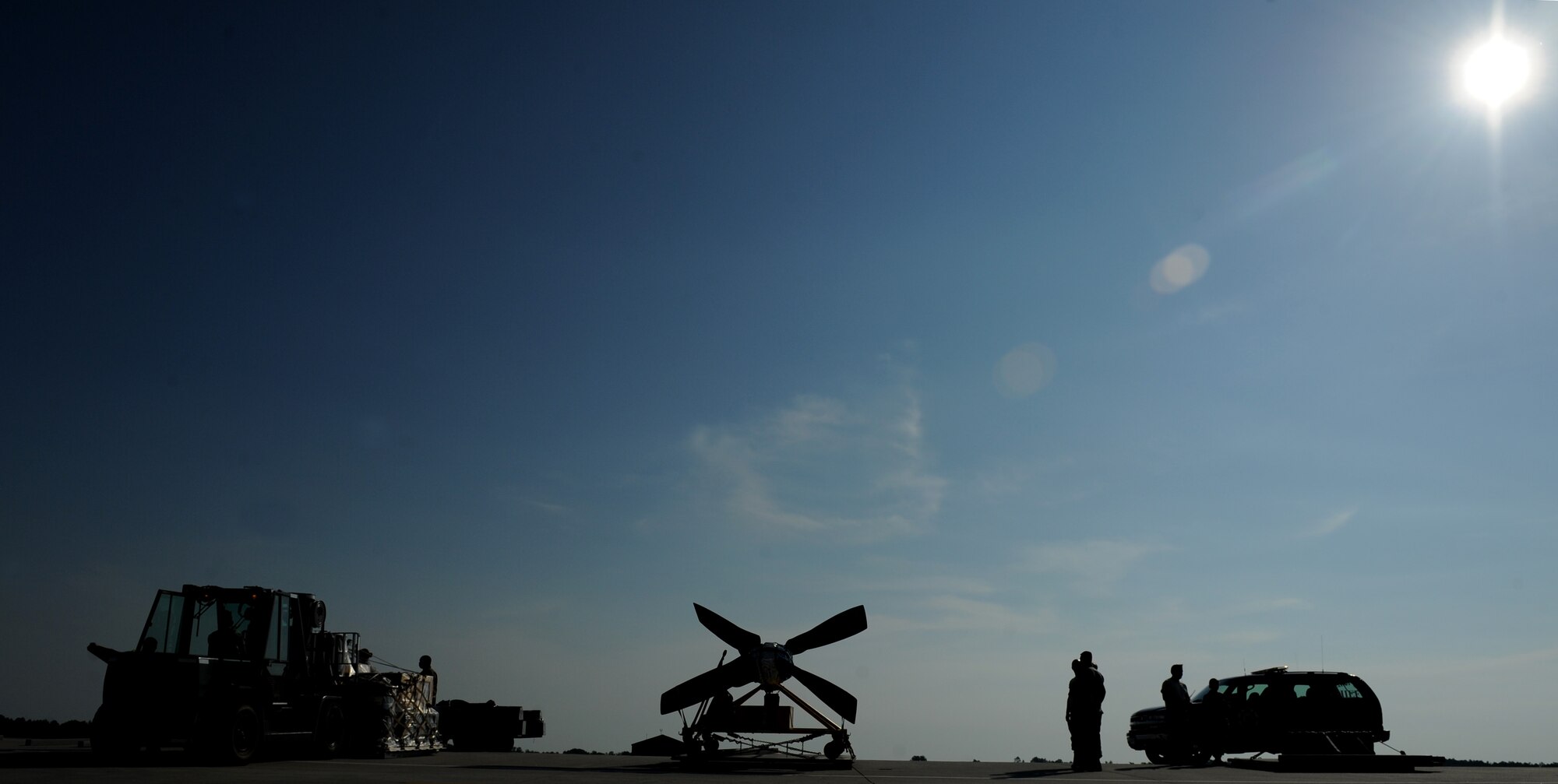 MOODY AIR FORCE BASE, Ga. -- Members of the 23rd Logistic Readiness Squadron take a moment to rest in between cargo movement on the flightline during an operational readiness exercise here June 3. Airmen should always remember to hydrate and protect themselves from the sun while working under direct sunlight. (U.S. Air Force photo by Senior Airman Gina Chiaverotti)