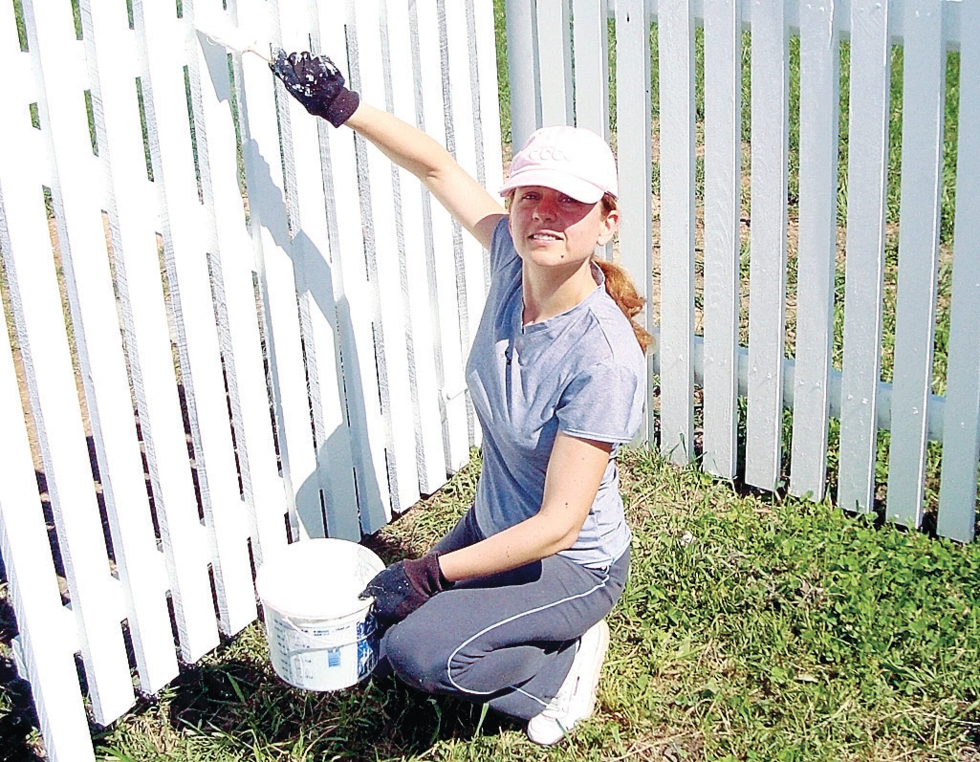 Capt. Dana Longo, 43rd Medical Group, paints a fence on the Joseph Phoffenberger Farm, a historical landmark located on the north side of the Civil War battlefield of Antietam. 