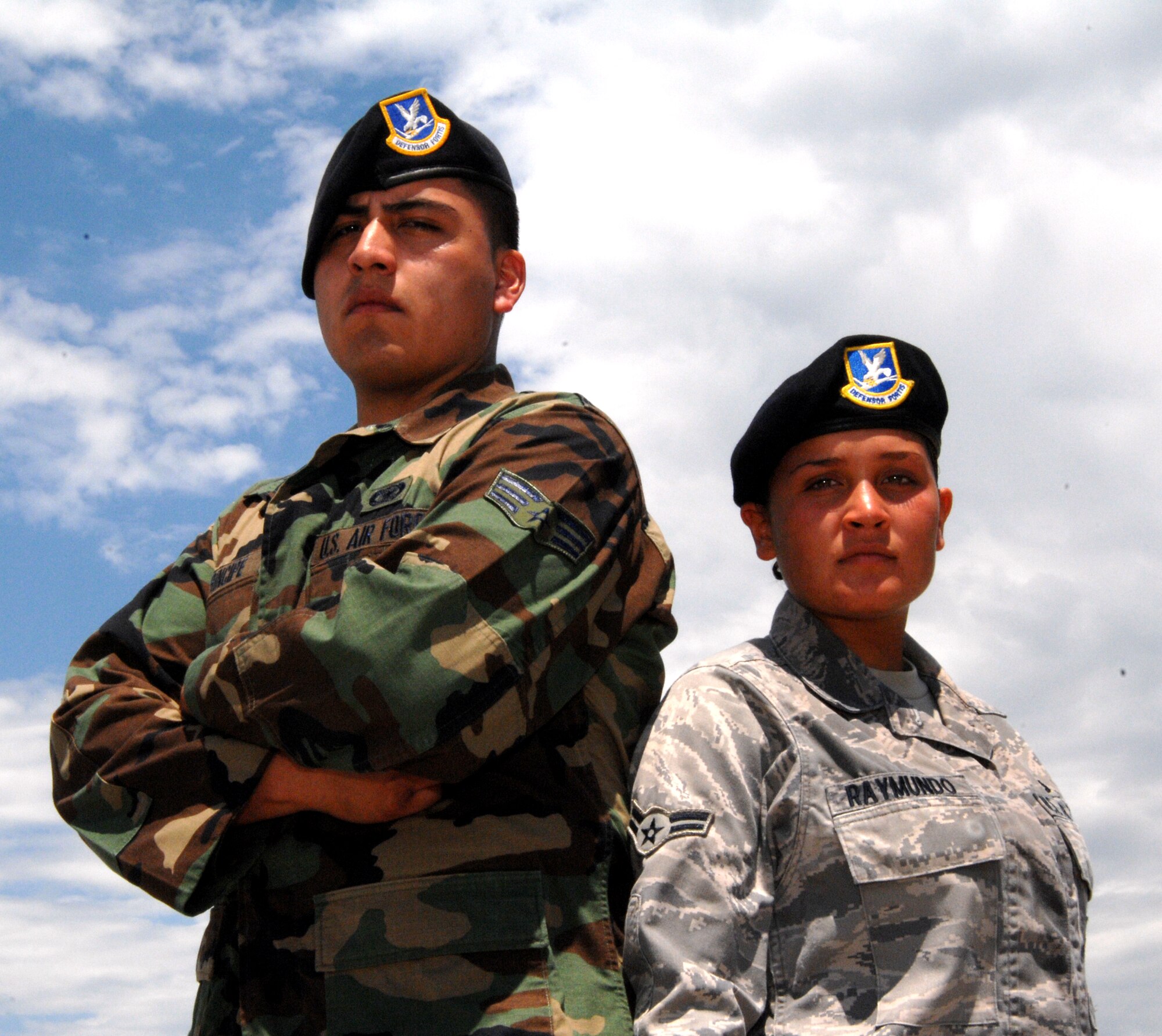 WHITEMAN AIR FORCE BASE, Mo. - (From left to right) Senior Airman Diego Principe and Airman 1st Class Monica Raymundo, 509th Security Forces Squadron, are just two fo the many Airmen supporting the Wings Over Whiteman Airshow. (U.S. Air Force photo/Master Sgt. Stan Coleman)