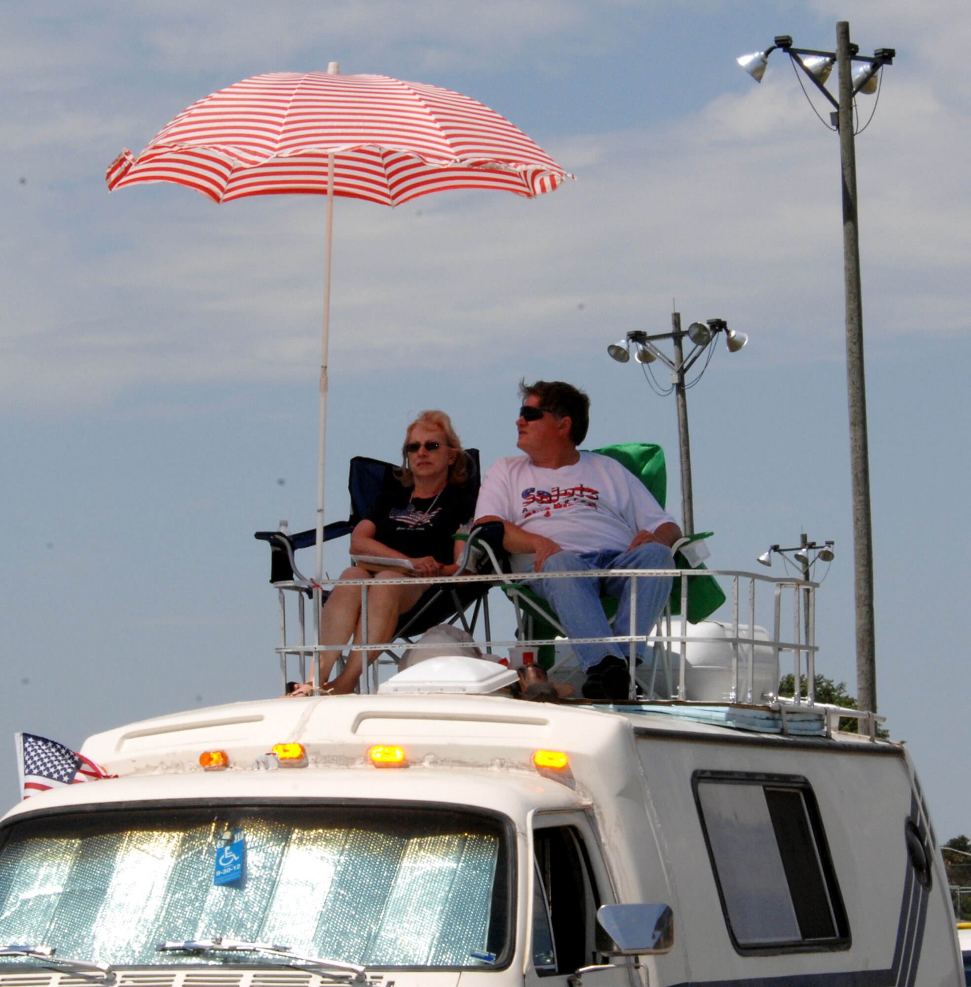 WHITEMAN AIR FORCE BASE, Mo. - Scott Wilson and his wife Velma of 38 years enjoy their third airshow at Whiteman AFB from the "best seat in the house." Mr. Wilson enjoys watching the fighter aircraft especially as they seem to "turn off the sound of their engines." Mrs. Wilson enjoys the different bomber aircraft. (U.S. Air Force photo/Master Sgt. Stan Coleman)