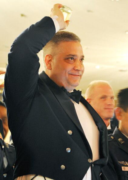 MISAWA AIR BASE, Japan -- Chief Master Sgt. Rick Price, 35th Fighter Wing command chief, ensures his cup is empty during the 3rd Annual Bilateral Enlisted Dining-Out June 5, 2009. Dining outs are traditional military events that encompass drinking from a “grog bowl.” (U.S. Air Force photo by Senior Airman Chad C. Strohmeyer)