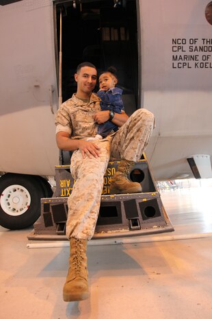 Cpl. Angelo Velez, an aircraft communications and navigation systems technician with Marine Aerial Refueler Transport Squadron 352, Marine Corps Air Station Miramar, Calif., is single-handedly raising his nine-month-old daughter, Jolisa, while upholding his responsibilities as a Marine. His wife, a specialist in the Army, has been deployed for the past three months.
