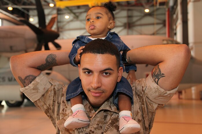 Cpl. Angelo Velez, an aircraft communications and navigation systems technician with Marine Aerial Refueler Transport Squadron 352, Marine Corps Air Station Miramar, Calif., is single-handedly raising his nine-month-old daughter, Jolisa, while upholding his responsibilities as a Marine. The Brooklyn, N.Y., native said his experience as a single father has taught him to be a stronger leader; firm and caring, like a big brother.