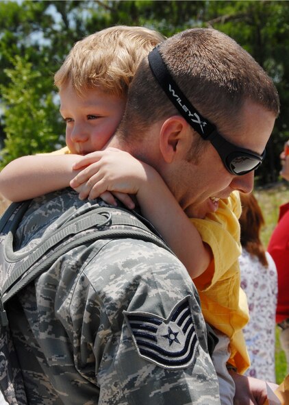 Tech Sgt. Tony Measel, 919th Maintenance Squadron, gets a hug from his son at Duke Field June 4, after returning from a deployment to Bagram Air Base, Afghanistan.  Friends and family members came out to welcome back the approximately 30 people who returned June 4.  (U.S. Air Force photo/Staff Sgt. Samuel King Jr.)