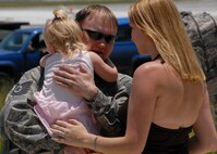 Tech. Sgt. Andrew Collins, 919 Maintenance Operations Flight, gets an extended hug from his daughter June 4 at Duke Field, after returning from a deployment to Bagram Air Base, Afghanistan.  Friends and family members came out to welcome back the approximately 30 people who returned June 4.  (U.S. Air Force photo/Staff Sgt. Samuel King Jr.)