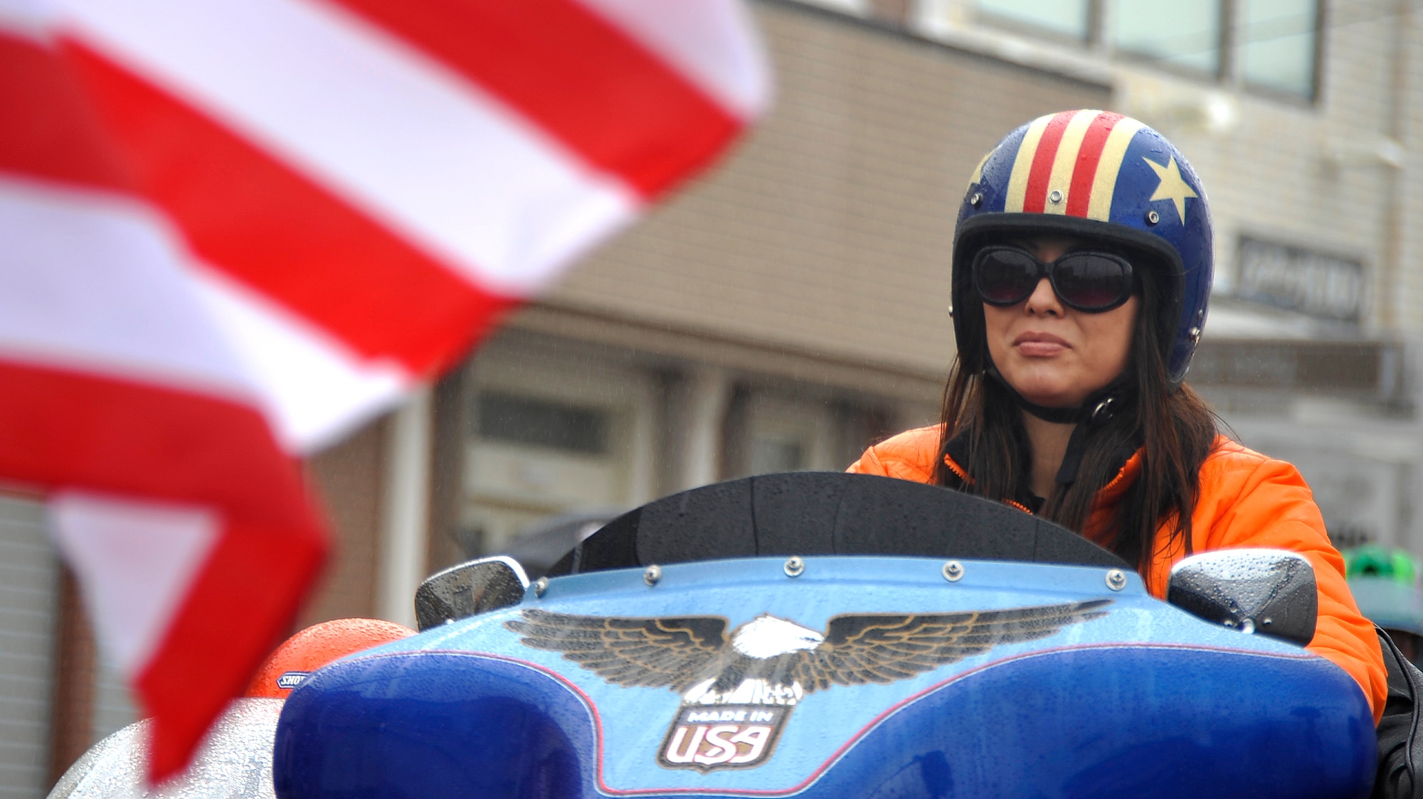 MISAWA AIR BASE, Japan -- A Japanese woman rides her motorcycle during the American Day parade June 7, 2009. The parade consisted of gymnasts, dancers, show cars and various military displays. (U.S. Air Force photo by Senior Airman Chad C. Strohmeyer)