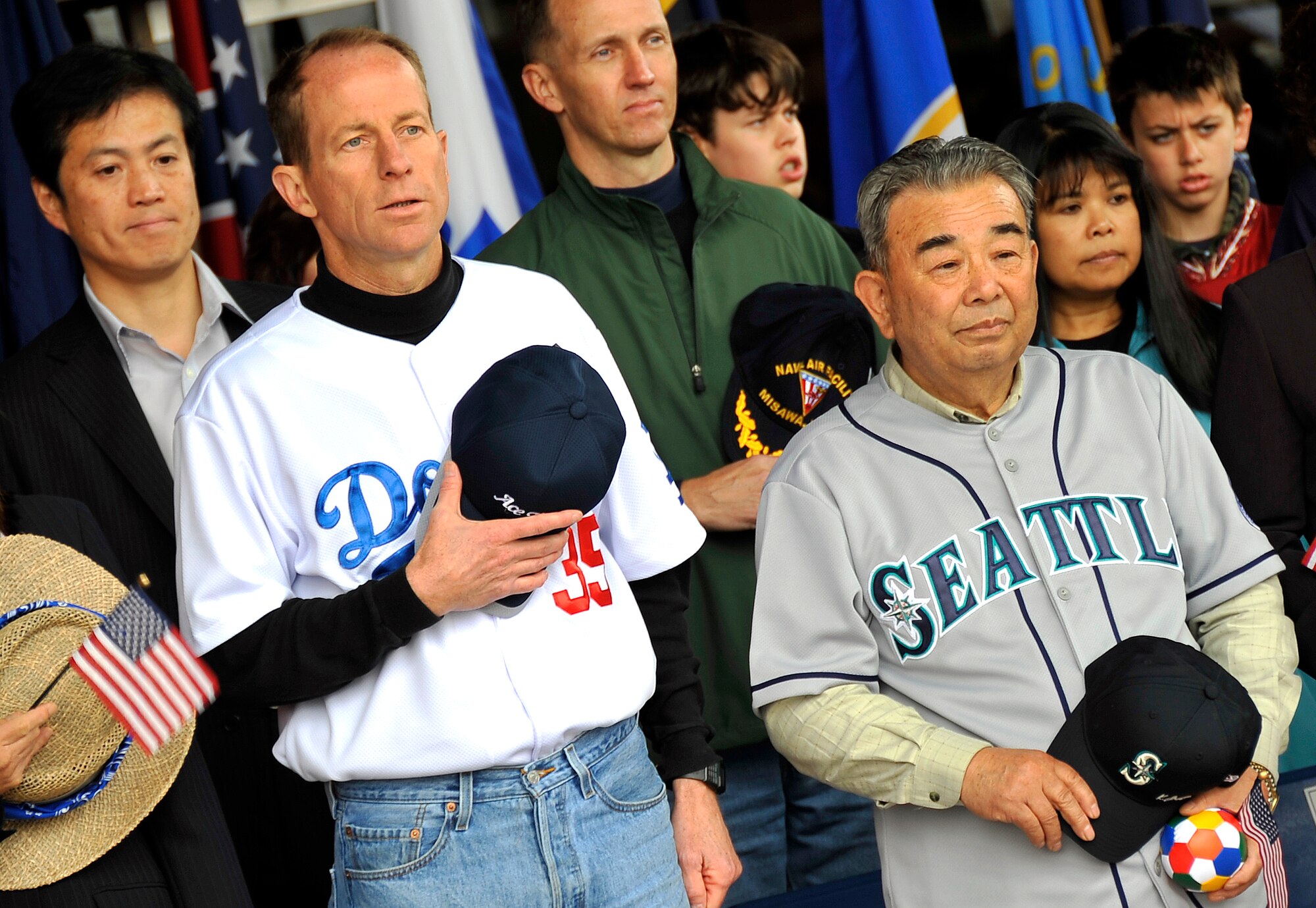 MISAWA AIR BASE, Japan -- Col. David Stilwell, 35th Fighter Wing commander, and Misawa City Mayor Kazumasa Taneichi, stand while the Japanese and American national anthems play during the American Day opening ceremony June 7, 2009. This marks the 21st annual American Day held in Misawa City. (U.S. Air Force photo by Senior Airman Chad C. Strohmeyer)