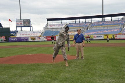 Major General Abraham J. Turner, Chief of Staff, U.S. Strategic Command, throws out a ceremonial first pitch for Military Appreciation Day at Rosenblatt Stadium, Omaha Nebraska on June 7th, 2009.