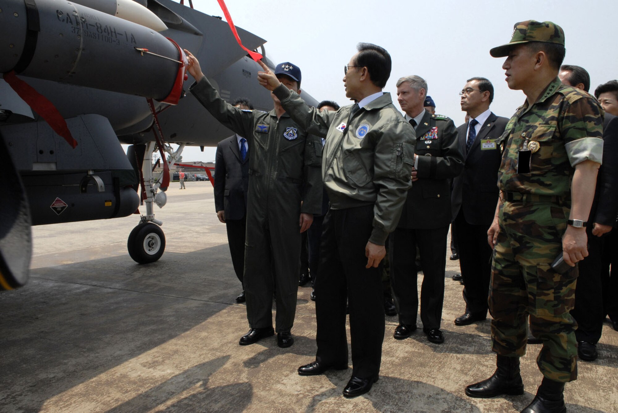 The president of South Korea Lee Myung-bak admires a Republic of Korea F-15 weapon at Osan Air Base on June 6.  During his visit, he received a tour of the base and briefings from Air Force and Republic of Korea service members. This is the first time that President Lee has visited Osan Air Force Base. (U.S. Air Force photo by Senior Airman Stephenie Wade)