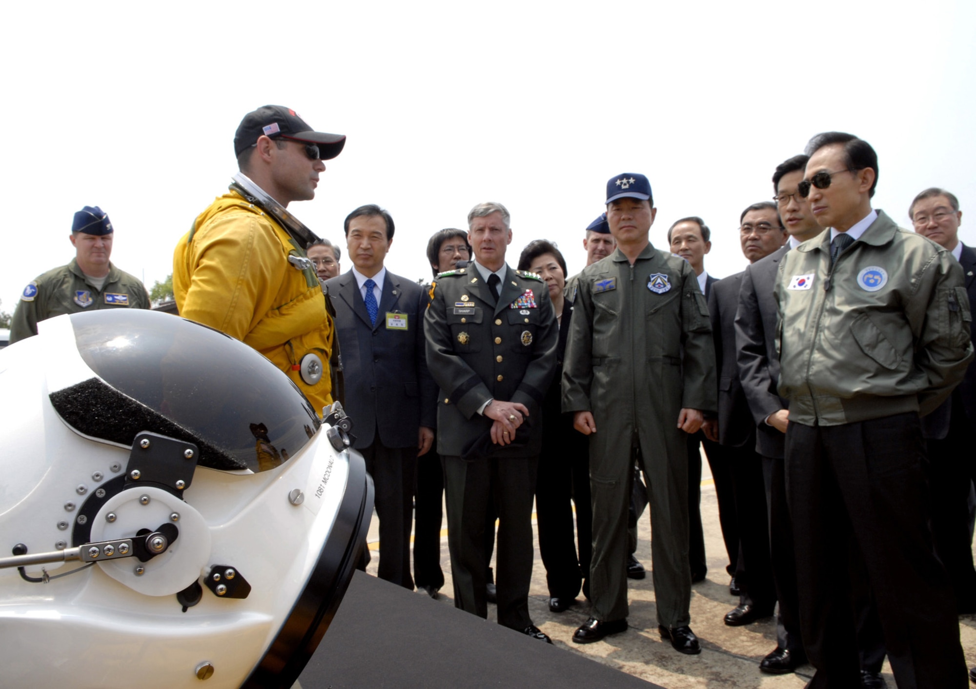 The president of South Korea Lee Myung-bak receives a briefing from U-2 pilot at Osan Air Base on June 6.  During the visit, he received a tour of the base and briefings from Air Force and Republic of Korea service members. This is the first time that President Lee has visited Osan Air Force Base. (U.S. Air Force photo by Senior Airman Stephenie Wade)