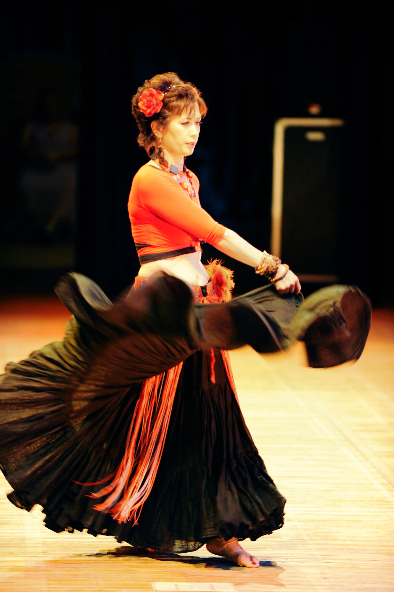 MISAWA CITY, Japan -- Satou Hiroko spins her dress while dancing "Gypsy Trail" at the Misawa Civic Center June 7, 2009. Several American and American-lead music and dance groups performed inside the Civic Center to share their art with the Japanese audience during the American Day festival. (U.S. Air Force photo by Staff Sgt. Samuel Morse)