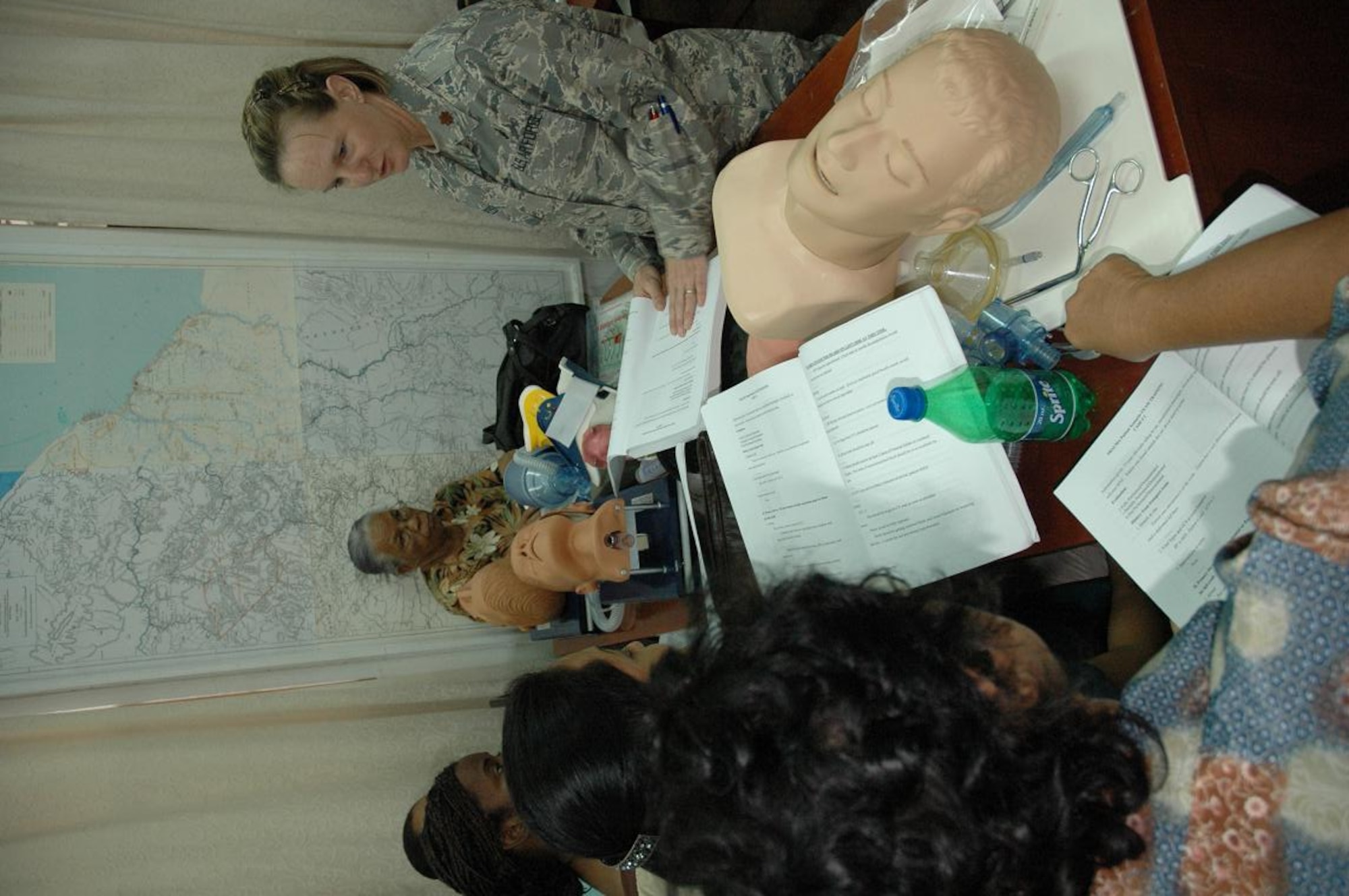 Capt. Kimberly Reed (right), chief, clinical operations for the Defense Institute for Medical Operations at Brooks City Base, Texas, leads classroom instruction during the first responders course taught in Georgetown, Guyana June 1-5. (U.S. Air Force Photo by Kevin Walston)