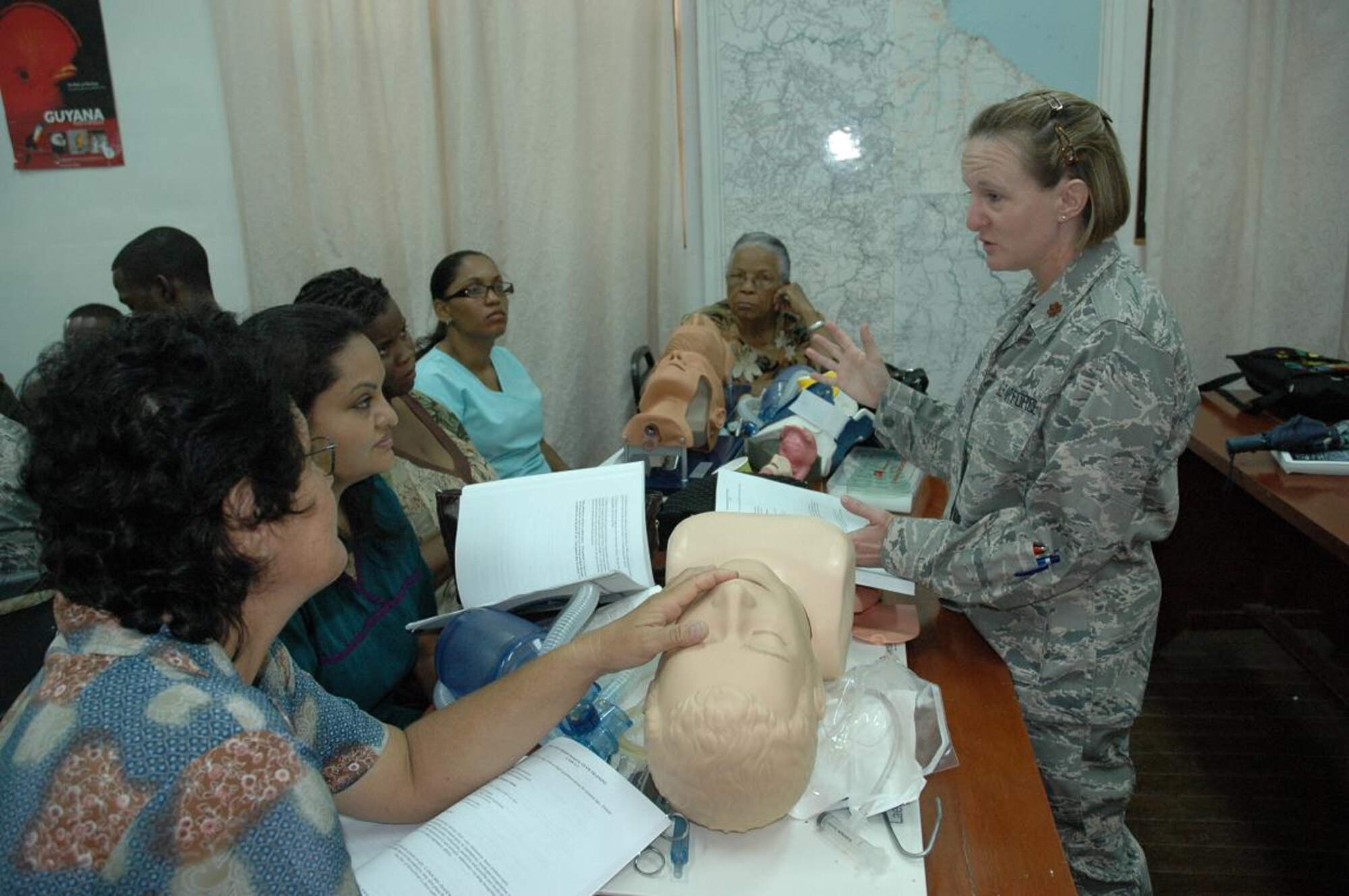 Capt. Kimberly Reed(right), chief, clinical operations for the Defense Institute for Medical Operations at Brooks City Base, Texas, leads classroom instruction during the first responders course taught in Georgetown, Guyana June 1-5. (U.S. Air Force Photo by Kevin Walston)