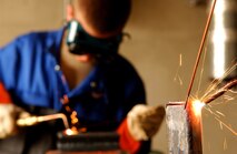 Airmen and local nationals practice shielded metal arc welding June 4 at Kadena Air Base, Japan. Personnel from vehicle mechanics and body shop  are completing a newly implemented welding course at the Pacific Air Forces Transportation Training Center.   (U.S. Air Force photo/Tech. Sgt. Rey Ramon)   