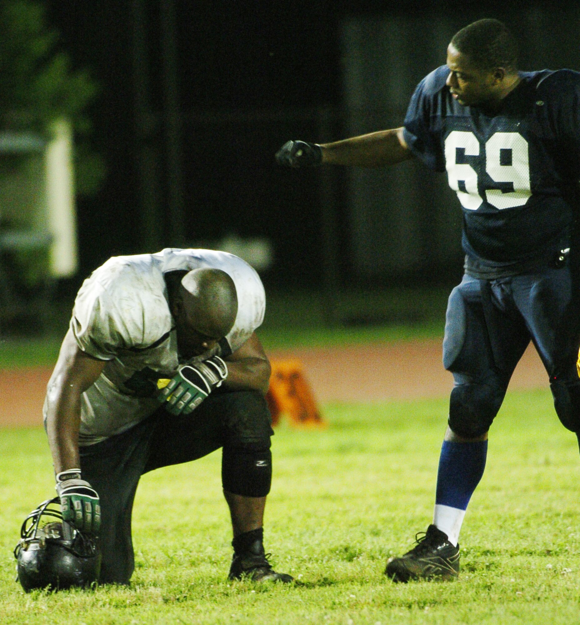 YOKOTA AIR BASE, Japan -- Yokota Warriors' lineman Davaines Brown (No. 69) congratulates an exhausted Misawa Jets lineman June 6 following the Warriors' 22-12 win over the Jets in U.S. Forces Japan-American Football League action. The win marked Yokota's first of the season, while Misawa dropped to 1-2. The Warriors' final home game at Bonk Field is set for 4 p.m. June 27 vs. Kadena. (U.S. Air Force photo/Master Sgt. Matt Summers)