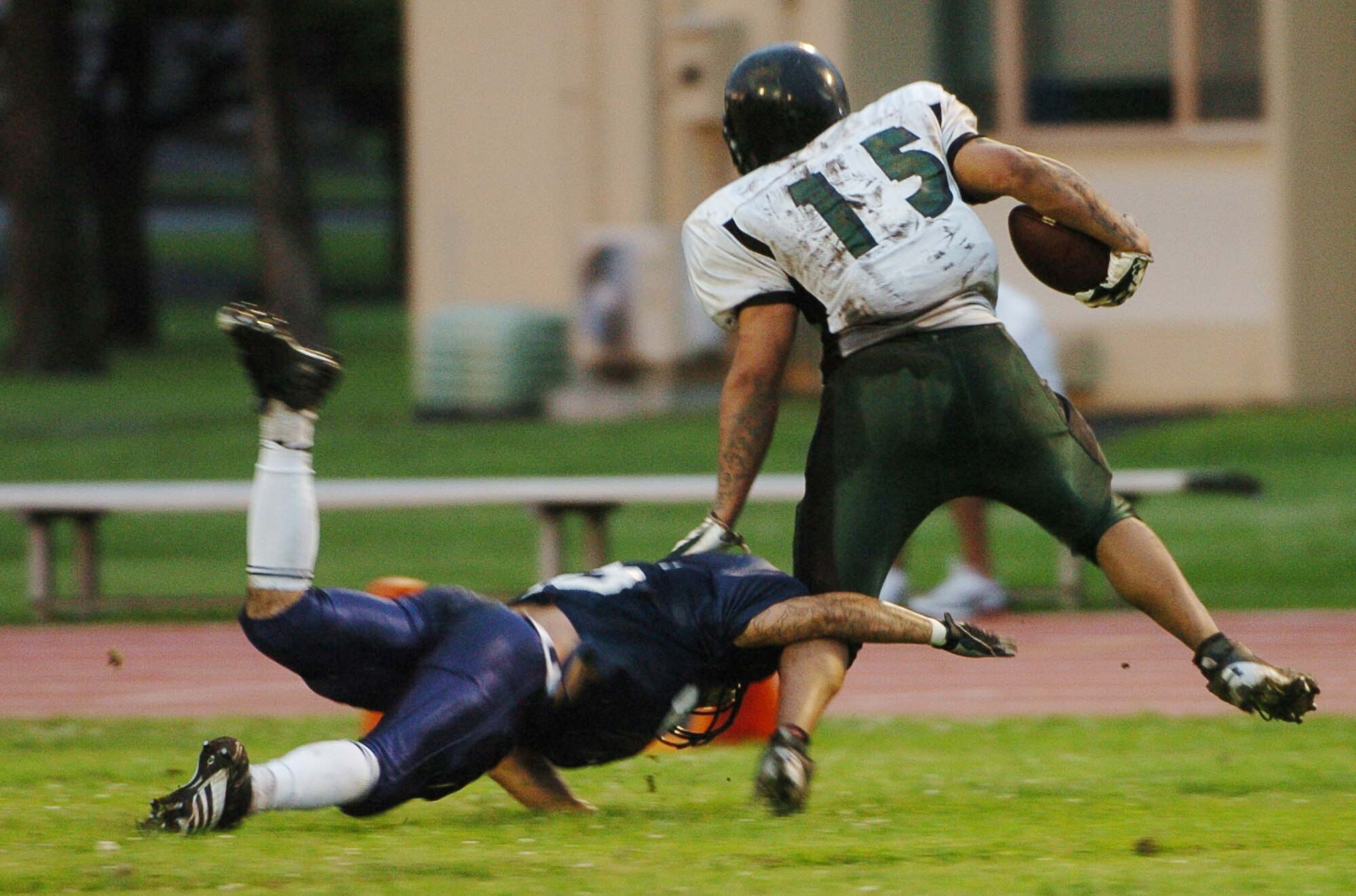 YOKOTA AIR BASE, Japan -- Yokota Warriors' cornerback Stephen Pasion makes an all-out effort to stop a Misawa receiver June 6 during the Warriors' 22-12 win over the Jets in U.S. Forces Japan-American Football League action. The win marked Yokota's first of the season, while Misawa dropped to 1-2. The Warriors' final home game at Bonk Field is set for 4 p.m. June 27 vs. Kadena. (U.S. Air Force photo/Master Sgt. Matt Summers)