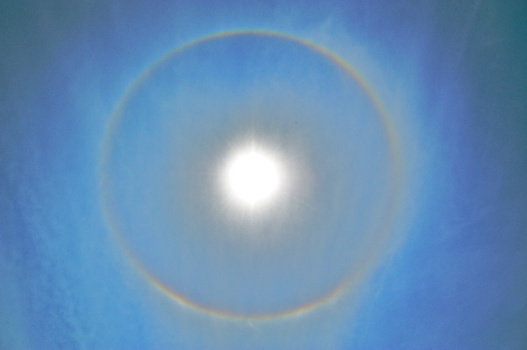 KEESLER AIR FORCE BASE, MISS -- If you saw a circular object around the sun in the afternoon sky, it was not a UFO, but a sundog. Many Citizen Airmen across the base took the time to appreciate this weather phenomenon that require special atmospheric conditions to occur. Sundogs are caused by refracted light through the prism of high level clouds made up of tiny ice crystals. The sun has to be at the right angle for the refraction to occur. Often, high-level clouds precede the rainfall from an oncoming frontal system. (U.S. Air Force Photo by Maj. Chad E. Gibson)