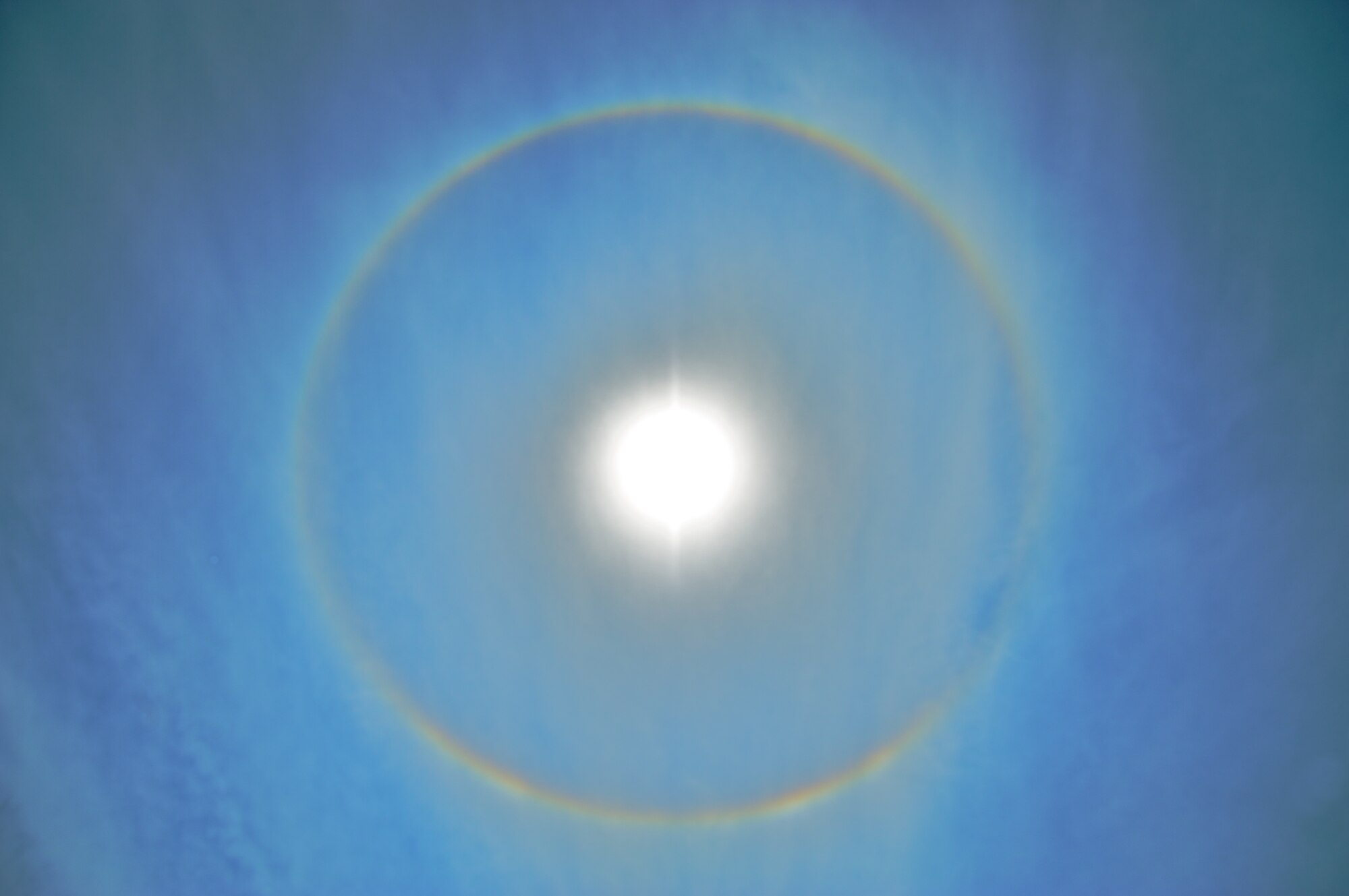 KEESLER AIR FORCE BASE, MISS -- If you saw a circular object around the sun in the afternoon sky, it was not a UFO, but a sundog. Many Citizen Airmen across the base took the time to appreciate this weather phenomenon that require special atmospheric conditions to occur. Sundogs are caused by refracted light through the prism of high level clouds made up of tiny ice crystals. The sun has to be at the right angle for the refraction to occur. Often, high-level clouds precede the rainfall from an oncoming frontal system. (U.S. Air Force Photo by Maj. Chad E. Gibson)