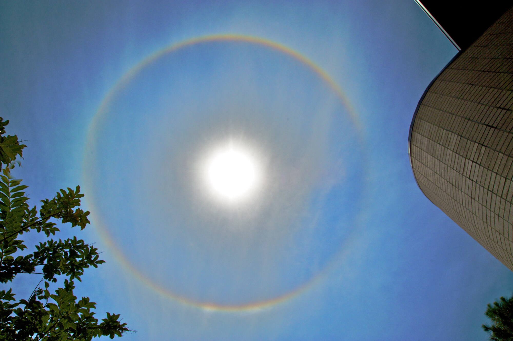 KEESLER AIR FORCE BASE, MISS -- If you saw a circular object around the sun in the afternoon sky, it was not a UFO, but a sundog. Many Citizen Airmen across the base took the time to appreciate this weather phenomenon that require special atmospheric conditions to occur. Sundogs are caused by refracted light through the prism of high level clouds made up of tiny ice crystals. The sun has to be at the right angle for the refraction to occur. Often, high-level clouds precede the rainfall from an oncoming frontal system. (U.S. Air Force Photo by Maj. Chad E. Gibson)