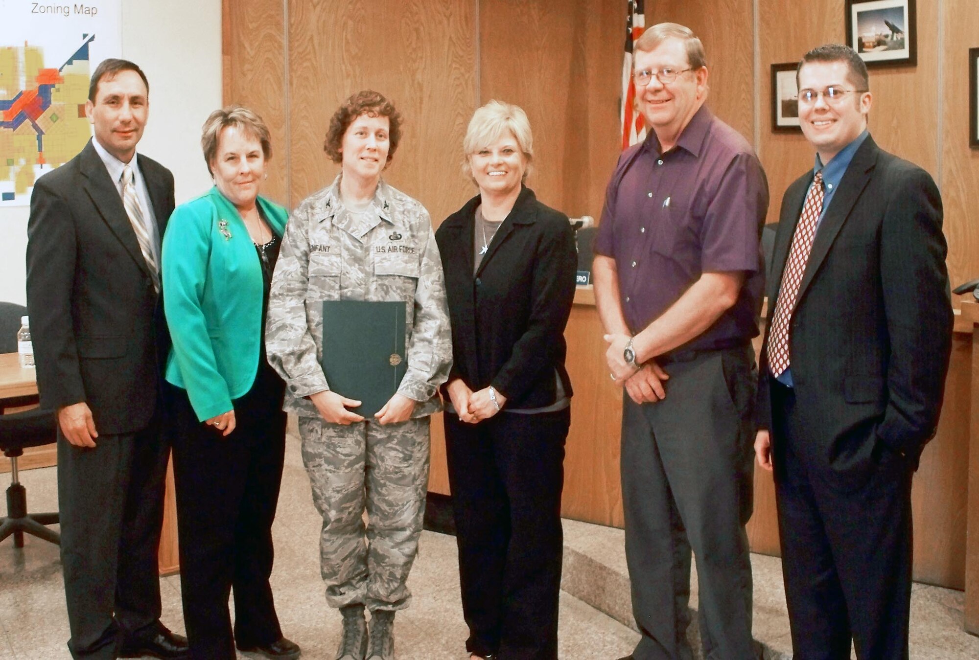 CANNON AIR FORCE BASE, N.M. ? Col. Babette Lenfant, 27th Special Operations Mission Support commander, receives an endorsement from Curry and Roosevelt County leadership for the National Public Service Award, May 1 in Portales, N.M. With her are (left to right) Orlando Ortega Jr., Portales mayor, Debi Lee, Portales city manager, Gayla Brumfield, Clovis mayor, Joe Thomas, Clovis city manager and Lance Pyle, Melrose city manager/Curry County manager. The NPSA winners will be announced in January and honors individuals who make outstanding contributions outside the work environment. (Courtesy photo) 