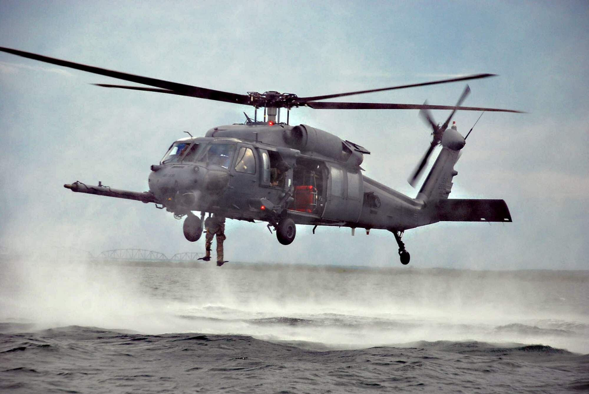 LAUGHLIN AIR FORCE BASE, Texas – A pararescue Airman stationed at Davis-Monthan Air Force Base, Ariz. jumps into Lake Amistad to perform a mock rescue during an exercise at Laughlin and in the surrounding community June 2. The exercise was held to prepare Laughlin, Davis-Monthan and the community for any potential natural disasters that could occur in the future. (U.S. Air Force photo by Airman 1st Class Sara Csurilla)