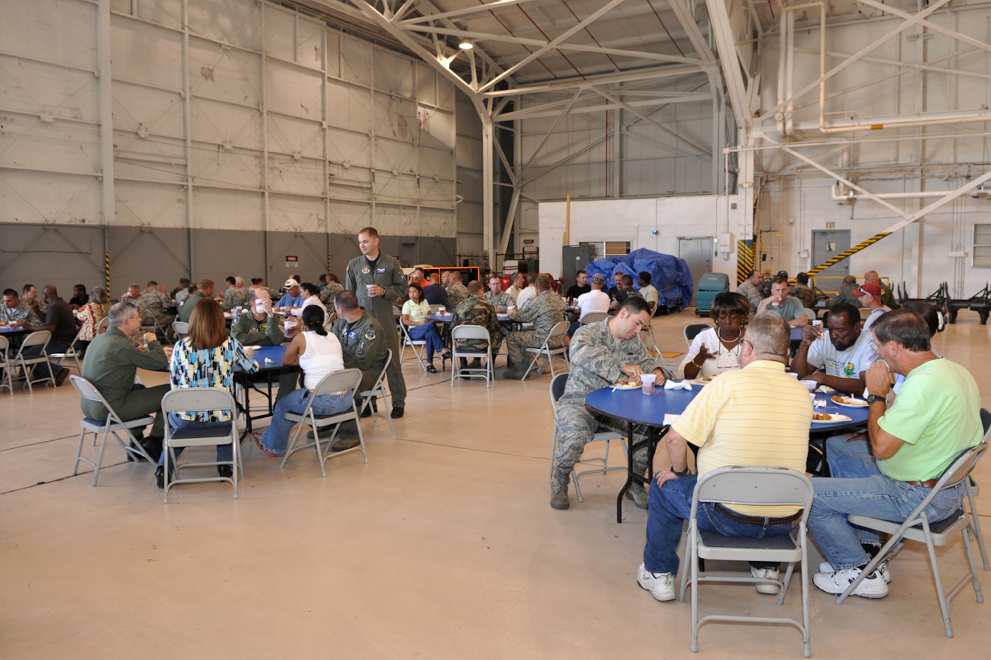 Airmen from the 917th Wing enjoy a chicken finger lunch in the A-10 Hangar at Barksdale Air Force Base, La., June 5, 2009, provided by Raising Cane’s Chicken Fingers restaurants from the Shreveport-Bossier area. Managers from several Cane’s restaurants pitched in to provide lunch in an effort to “do their part in supporting local men and women who serve our country every day.” (U.S. Air Force photo/Tech. Sgt. Jeff Walston)  