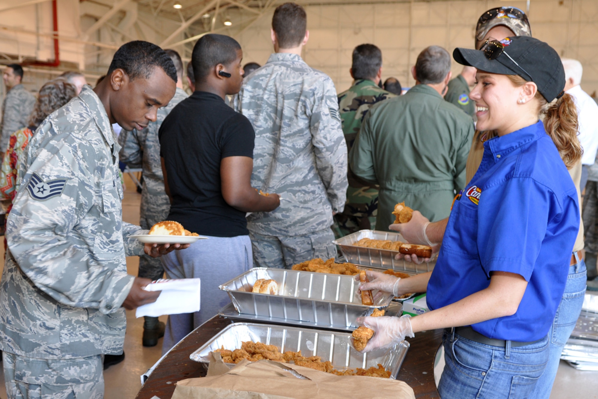 Staff Sgt. Anthony Jones, 917th Wing, recruiter, takes a break for lunch in the A-10 Hangar at Barksdale Air Force Base, La., June 5, 2005. Several Raising Cane’s Chicken Finger restaurants in the Shreveport-Bossier area provided lunch to 917th Airmen in an effort to “do their part in supporting local men and women who serve our country every day.” (U.S. Air Force photo/Tech. Sgt. Jeff Walston)