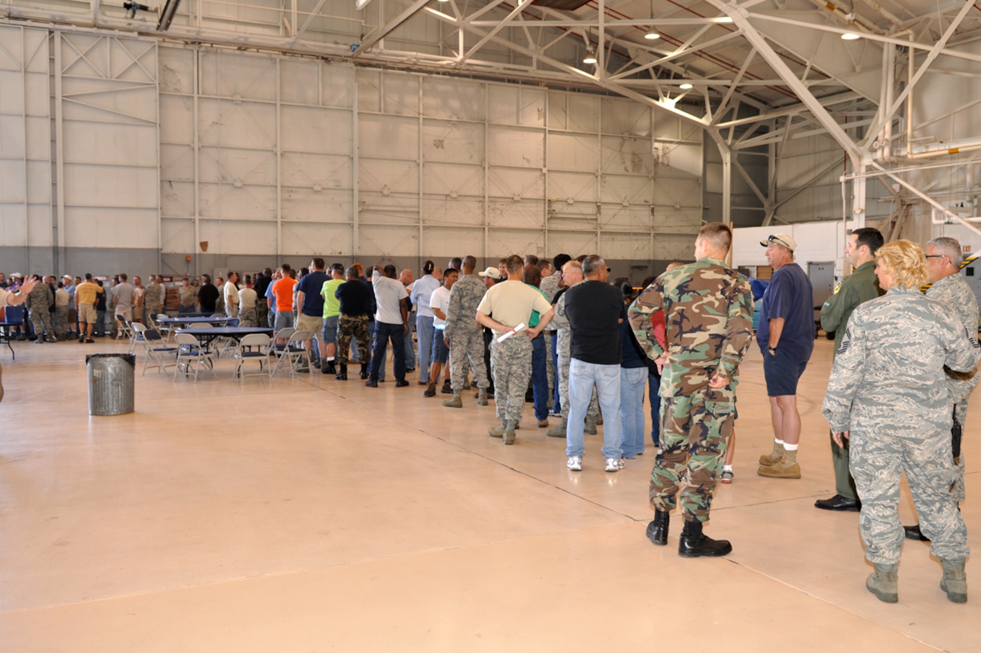 Airmen from the 917th Wing at Barksdale Air Force Base, La., form a line as managers from Raising Cane’s Chicken Fingers restaurants in the Shreveport-Bossier area serve up a chicken finger lunch for more than 400 wing personnel June 5, 2009, before the scheduled Unit Training Assembly weekend.  Managers from several of the restaurants pitched in to provide the lunch in an effort to “do their part in supporting local men and women who serve our country every day.” (U.S. Air Force photo/Tech. Sgt. Jeff Walston)  