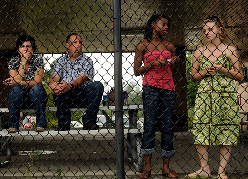 MOODY AIR FORCE BASE, Ga. -- Schelley Lanthorne, wife of Airman 1st Class Lee Lanthorne, 822nd Security Forces Squadron member, her parents and Katrina Stewart, wait outside the deployment control center as the 822nd SFS prepares to depart from here June 6. The 822nd SFS is deploying to Camp Bucca, Iraq. (U.S. Air Force photo by Senior Airman Brittany Barker) 