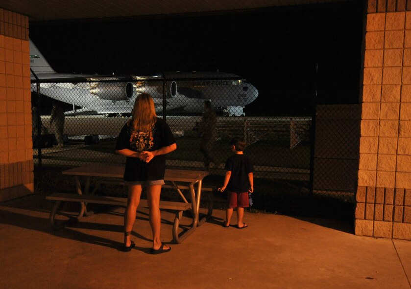 MOODY AIR FORCE BASE, Ga. -- Family members wait patiently for the return of 24 Airmen from the 723rd Aircraft Maintenance Squadron who arrived back from a recent deployment here June 5. (U.S. Air Force photo by Staff Sgt. Javier Cruz Jr.) 
