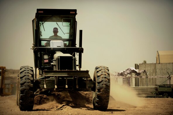 Staff Sgt. Derek Ross operates a grader May 7 at Kandahar Airfield, Afghanistan. RED HORSE members are assisting the 451st Air Expeditionary Group with airfield expansion to accommodate the influx of aircraft required to support the surge in Afghanistan. Sergeant Ross is an 819th Expeditionary Red Horse Squadron engineer. (U.S. Air Force photo/Staff Sgt. James L. Harper Jr.) 
