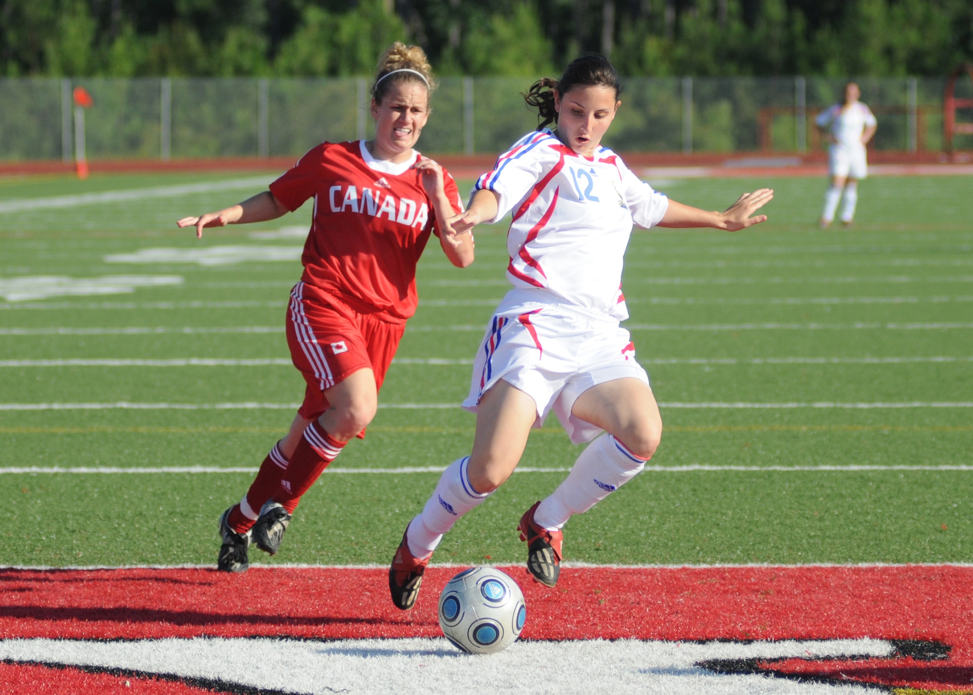 Canada and France compete during the 5th CISM Women’s Soccer Championship at Biloxi High School Stadium 7 June.  The CISM tournament, hosted by Keesler Air Force Base, includes teams from Brazil, Canada, France, Germany, The Netherlands, The Republic of South Korea and the United States.  Matches are being held June 6 to 13, with the Gold match June 13 at 2 p.m.  Organizers say the tournament gives teams and people who attend a chance to develop bonds and life-long friendships between the countries and a chance to learn about one another’s cultural similarities and differences.  (U.S. Air Force photo by Kemberly Groue)