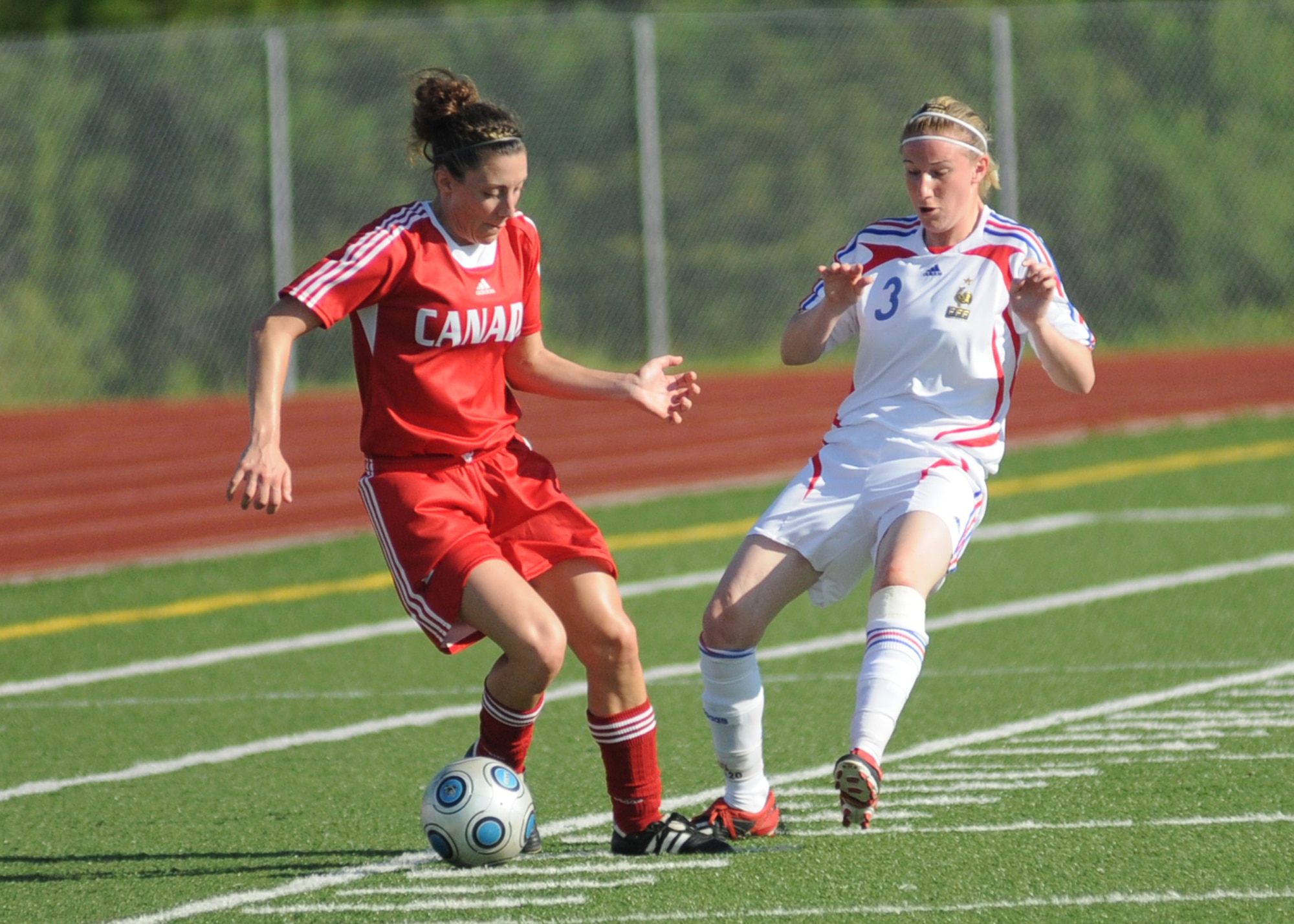 Canada and France compete during the 5th CISM Women’s Soccer Championship at Biloxi High School Stadium 7 June.  The CISM tournament, hosted by Keesler Air Force Base, includes teams from Brazil, Canada, France, Germany, The Netherlands, The Republic of South Korea and the United States.  Matches are being held June 6 to 13, with the Gold match June 13 at 2 p.m.  Organizers say the tournament gives teams and people who attend a chance to develop bonds and life-long friendships between the countries and a chance to learn about one another’s cultural similarities and differences.  (U.S. Air Force photo by Kemberly Groue)