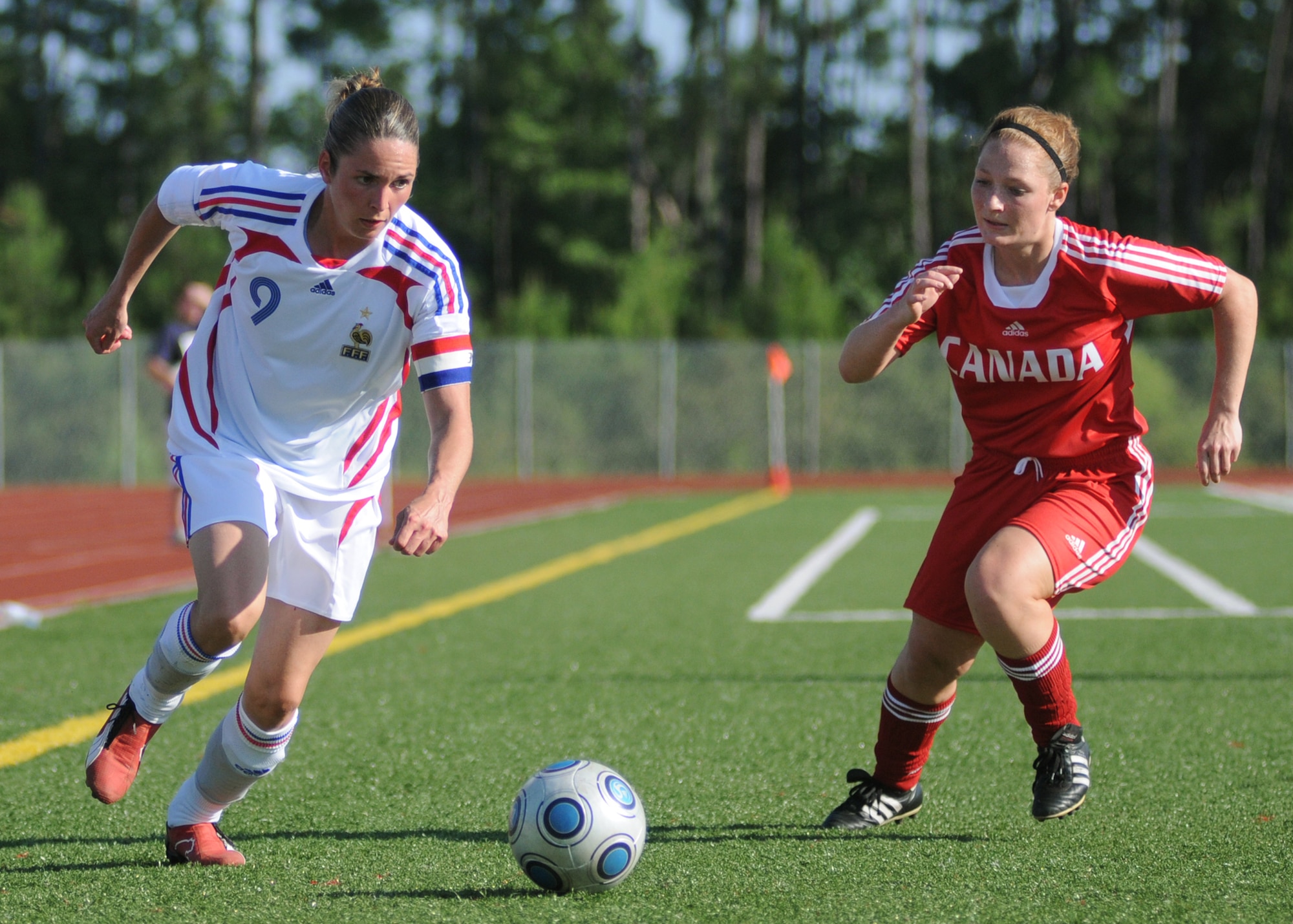 Canada and France compete during the 5th CISM Women’s Soccer Championship at Biloxi High School Stadium 7 June.  The CISM tournament, hosted by Keesler Air Force Base, includes teams from Brazil, Canada, France, Germany, The Netherlands, The Republic of South Korea and the United States.  Matches are being held June 6 to 13, with the Gold match June 13 at 2 p.m.  Organizers say the tournament gives teams and people who attend a chance to develop bonds and life-long friendships between the countries and a chance to learn about one another’s cultural similarities and differences.  (U.S. Air Force photo by Kemberly Groue)
