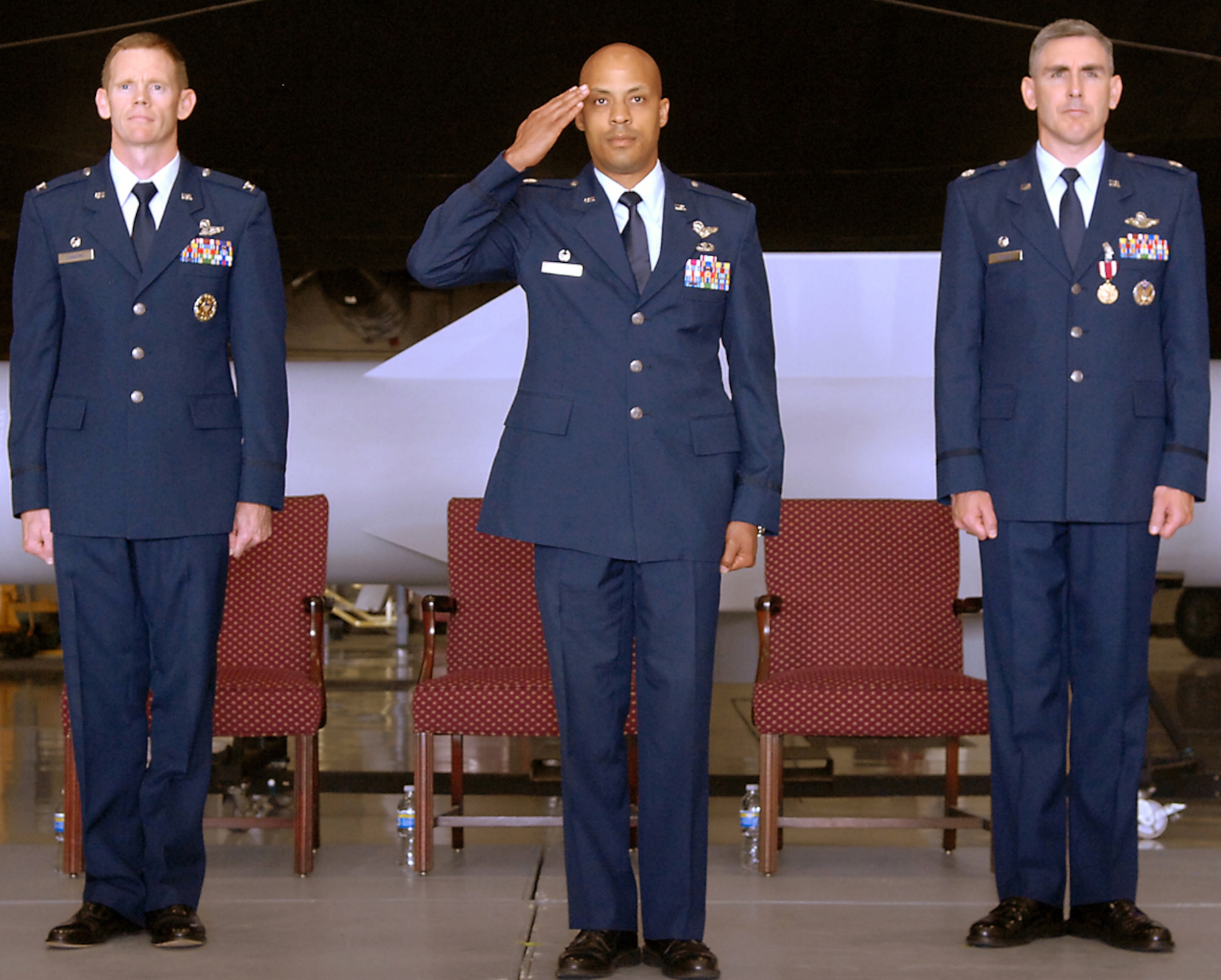 WHITEMAN AIR FORCE BASE, Mo. – Lt. Col. Samuel White, 393rd Bomb Squadron commander, returns his first salute June 2 to members of the 393rd BS as their new commander. Colonel White is flanked by Col. James Dawkins (left), 509th operations Group commander, and Lt. Col. John Vitacca, out-going 393rd BS commander. (U.S. Air Force photo/Staff Sgt. Jason Barebo)