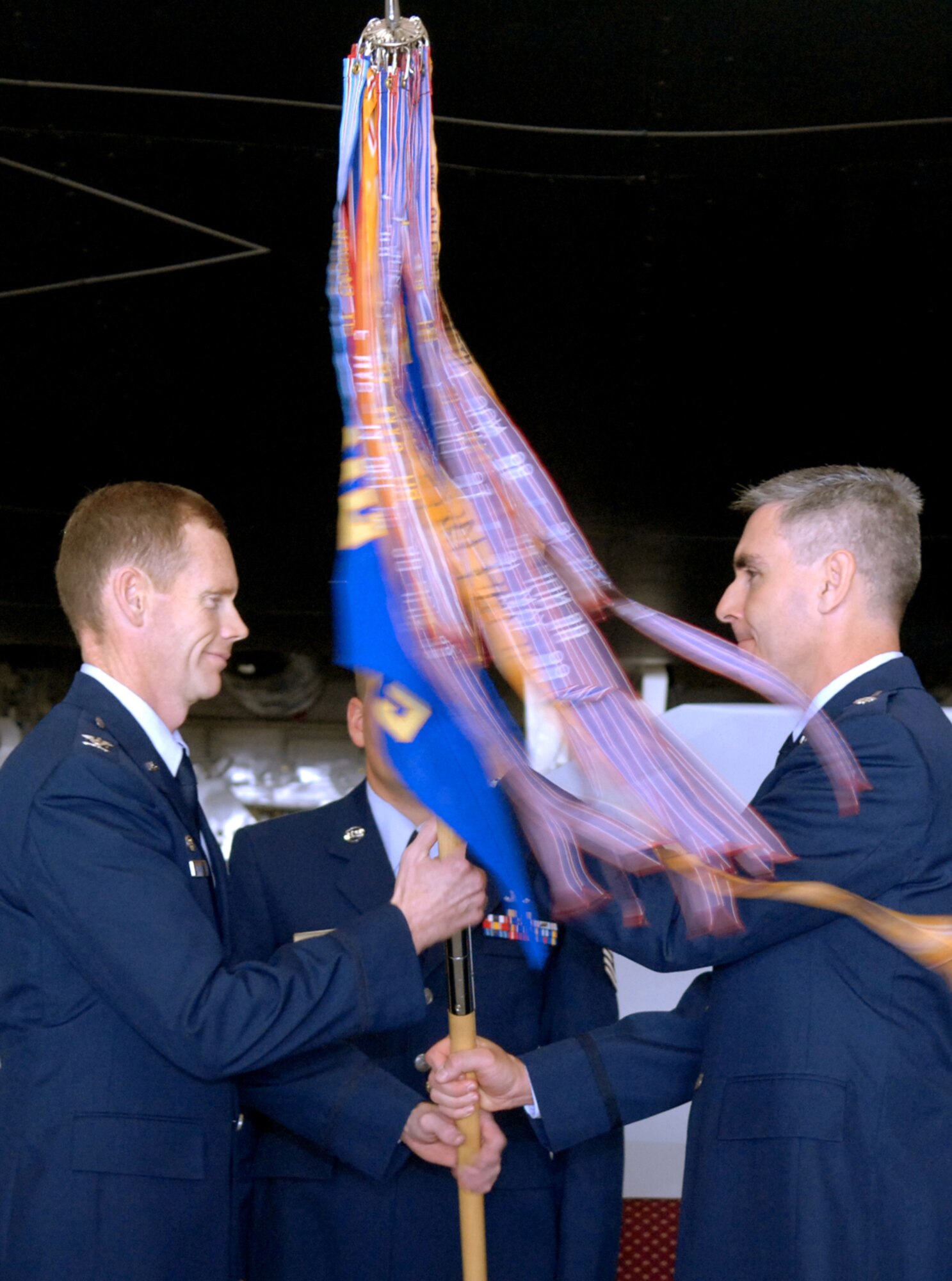 WHITEMAN AIR FORCE BASE, Mo. – Col. James Dawkins, 509th Operations Group commander, receives the 393rd Bomb Squadron guidon from Lt. Col. John Vitacca, out-going 393rd BS commander, June 2 during the 393rd BS Change of Command ceremony.  Colonel Vitacca is going on to Stanford University, Palo Alto, Calif., to study nuclear policy. (U.S. Air Force photo/Staff Sgt. Jason Barebo) 