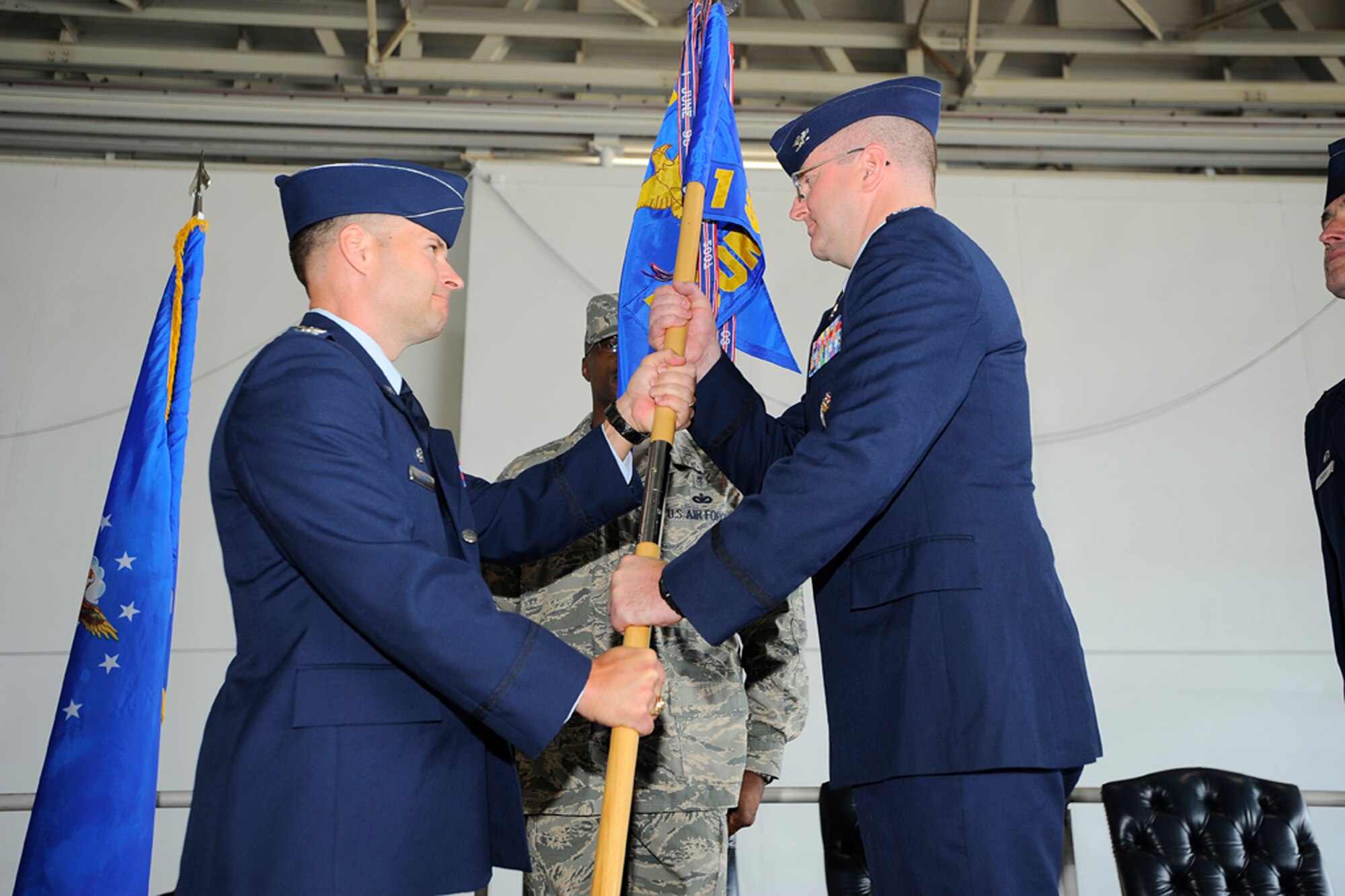 Col. Dale Agner receives the guidon from Col. Gregory Lengyel during the 1st Special Operations Medical Group Change of Command ceremony. Colonel Agner takes command of the medical group from Col. David Rhodes, who will be moving on to Brooks City Base, in San Antonio (Photo courtesy of Senior Airman Jason Epley). 